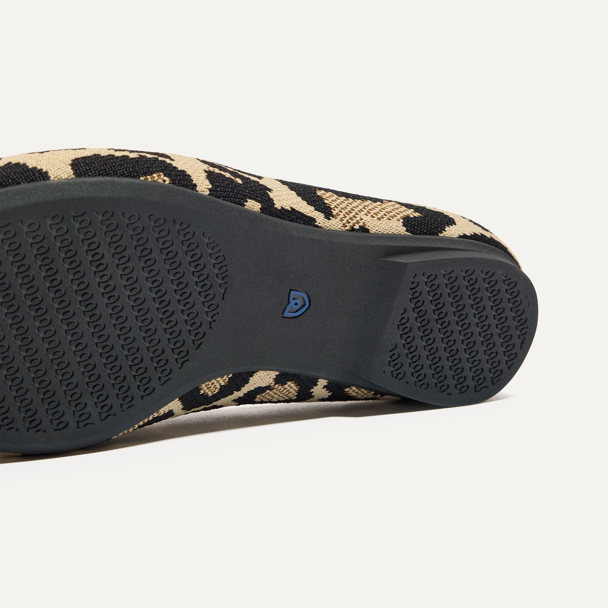 Close up of the outsoles of The Double Bit Loafer Mule in Desert Cat.