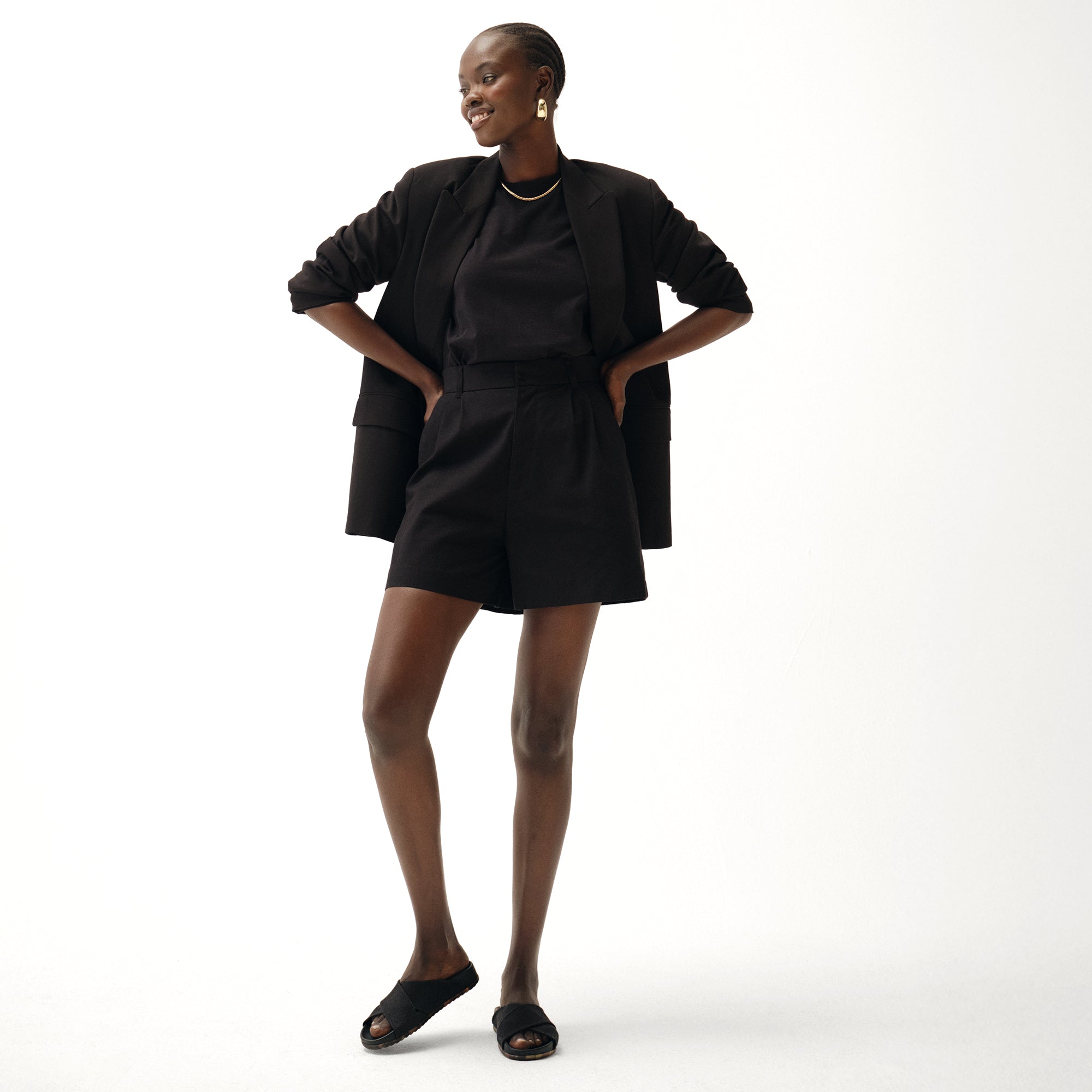 Alternate view of a model wearing The Weekend Slide in Black.