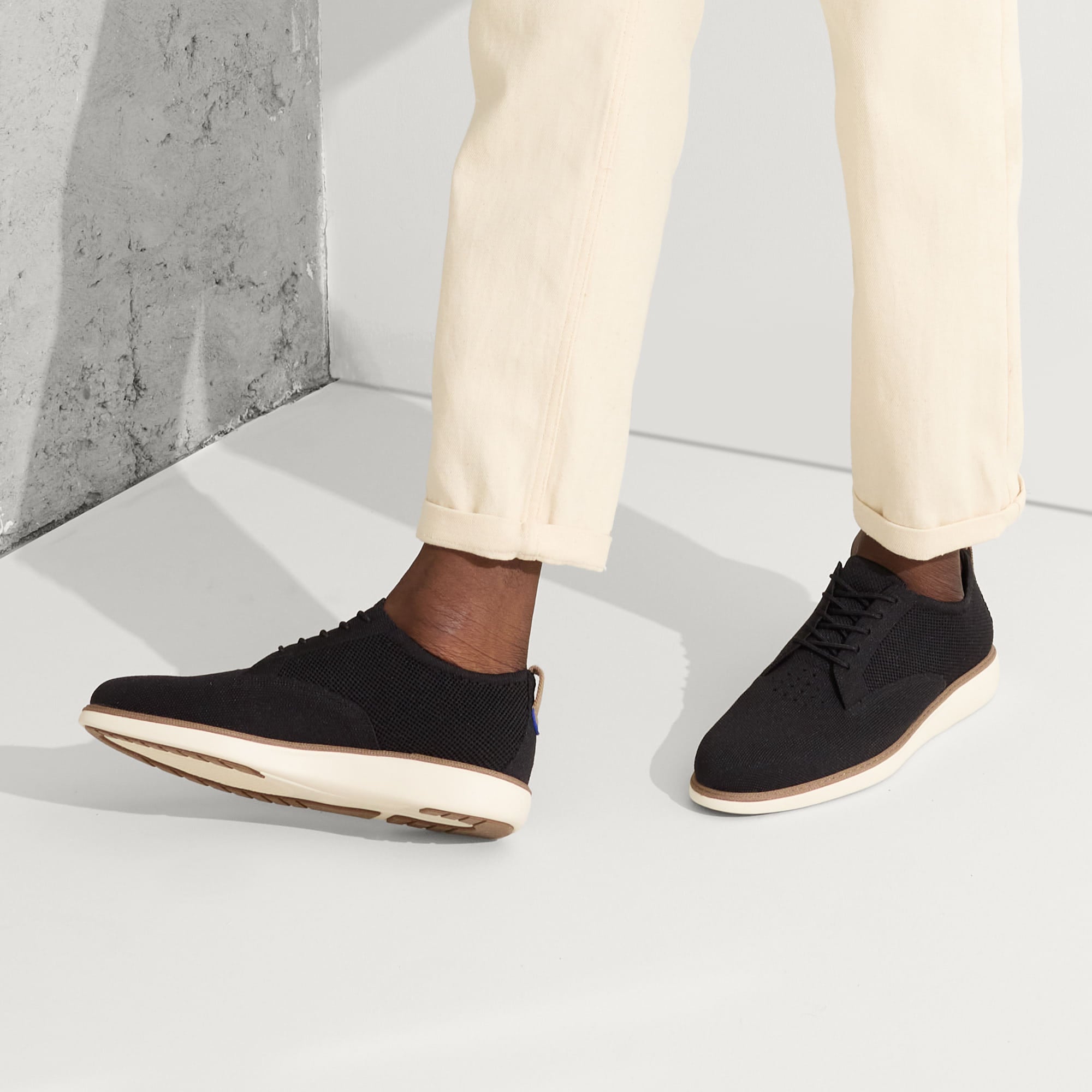 hover | Model wearing The Oxford in Black.