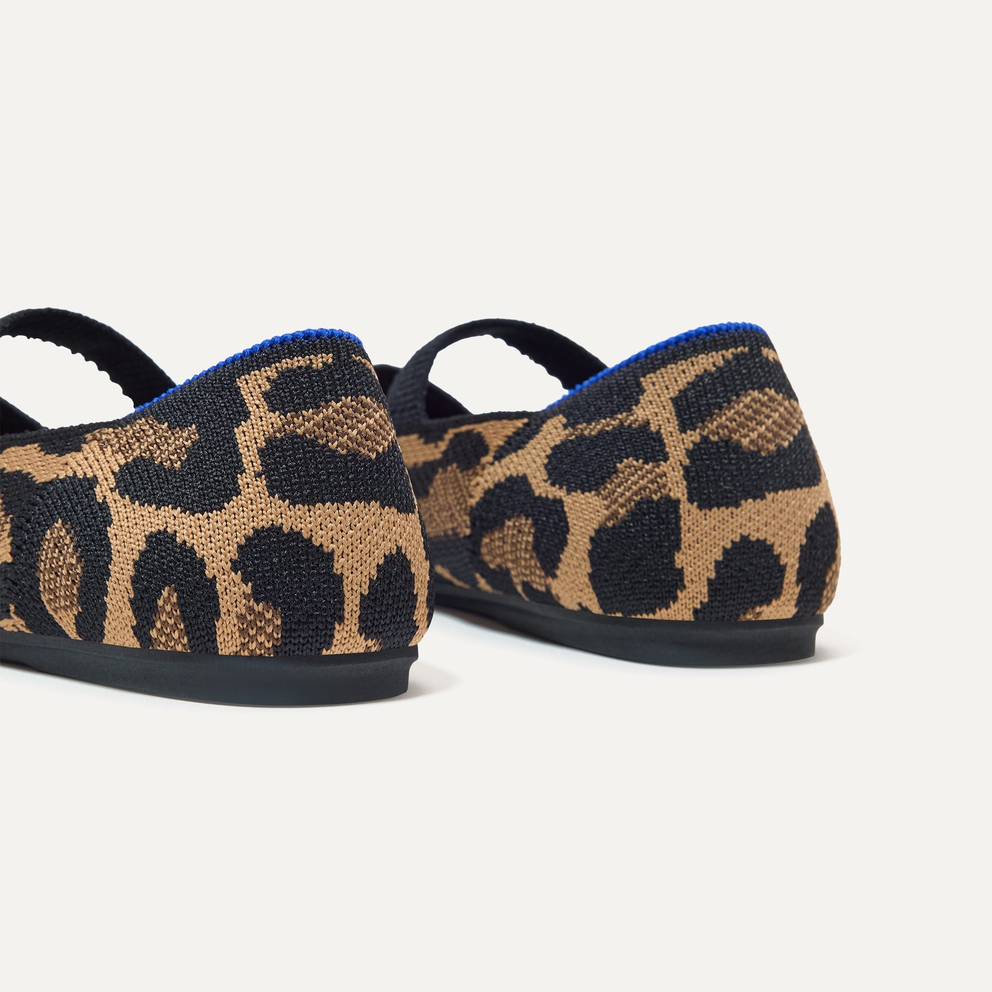 Close up of the heel of The Kids Mary Jane in Amber Cat, with shimmery gold pull tab.