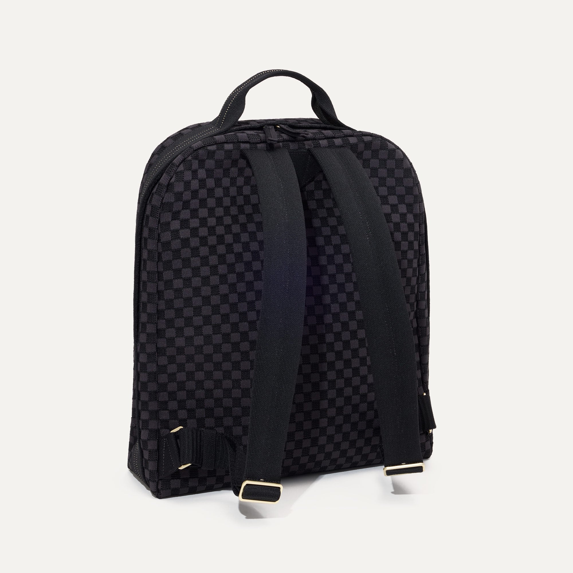 The Backpack in Black Sand shown from the back.