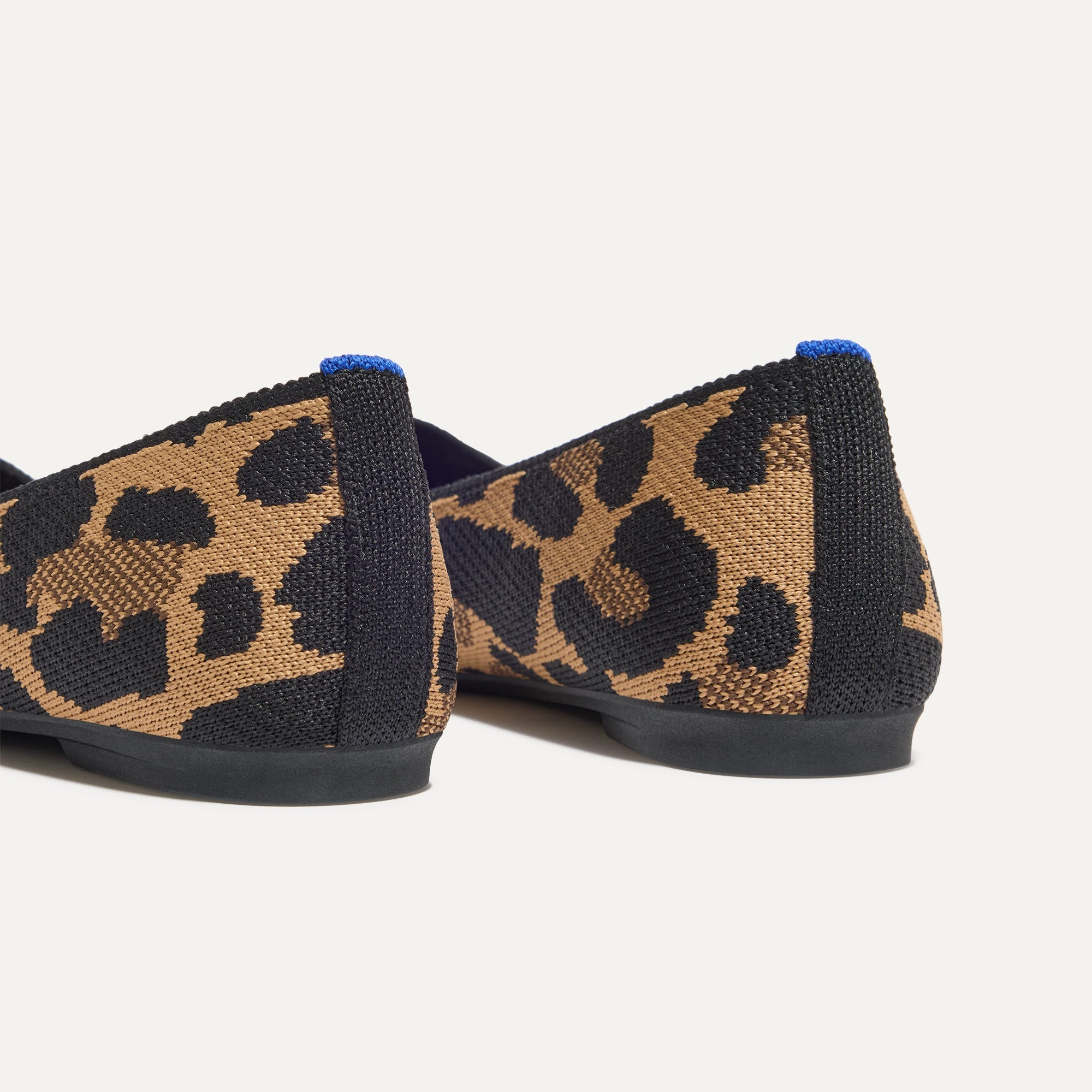 Close up of the heel of The Max Square in Amber Cat with Rothy's signature blue halo.