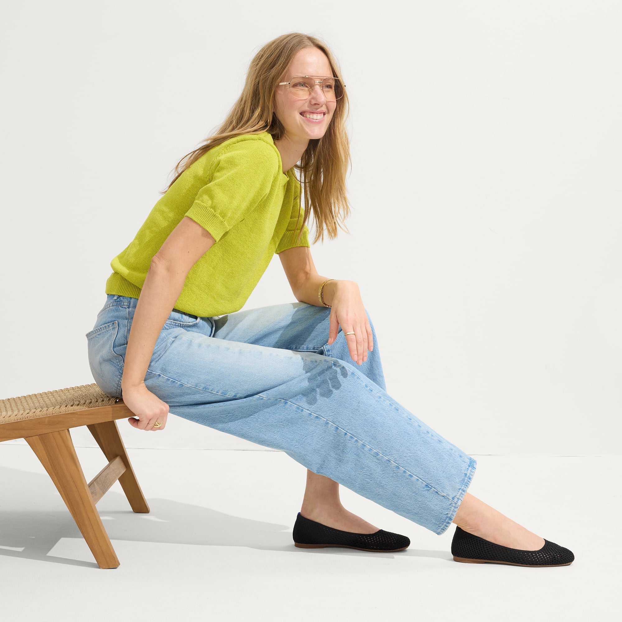 Alternative angle of model wearing The Max Square in Black Mesh.