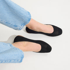 hover | Model wearing The Max Square in Black Mesh.