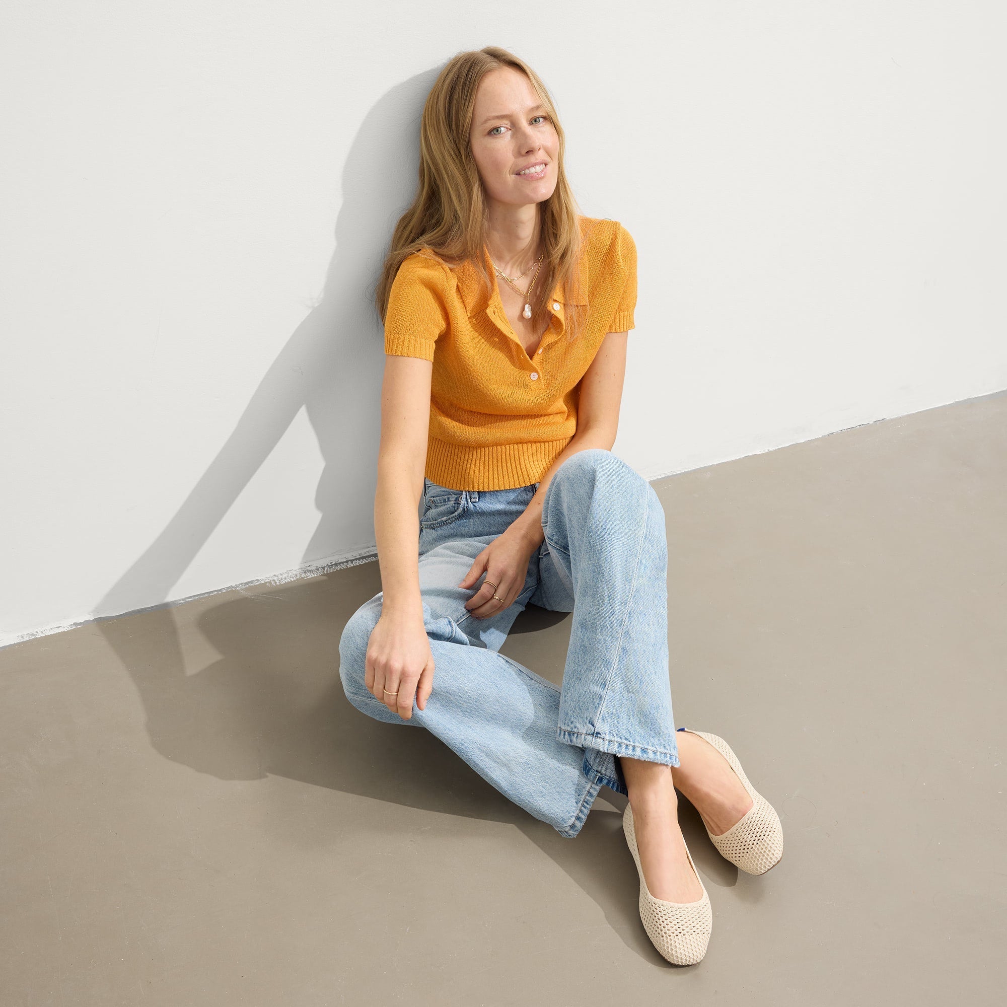 Alternative angle of model wearing The Max Square in Off White Mesh.