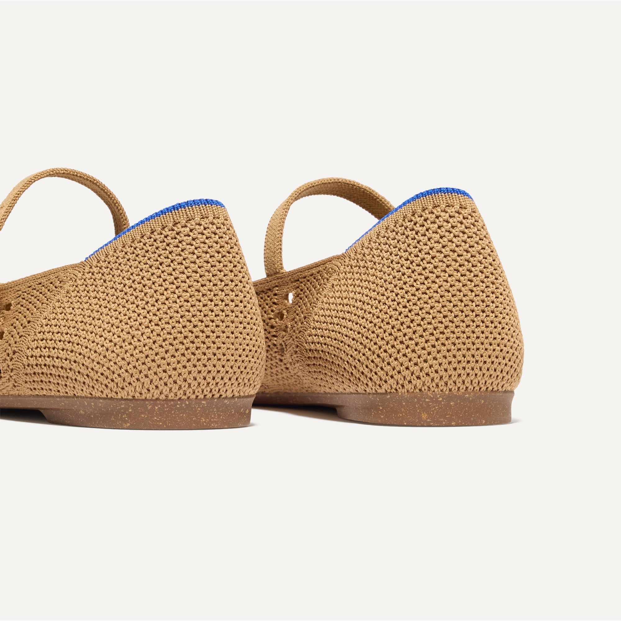 Close up of the heel of The Point Mary Jane II in Wren Crochet, with Rothy's signature blue halo.