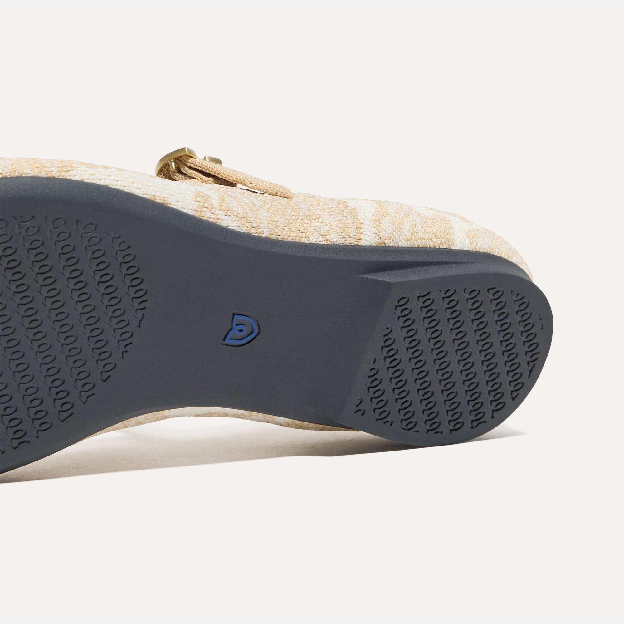 The sole of The Point Mary Jane II in White Chantilly shown in diagonal view.