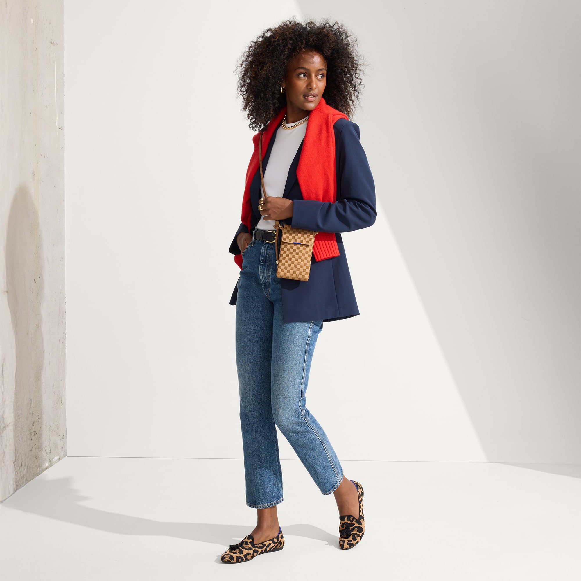 An alternate view of a model wearing The Phone Crossbody in Hazelnut.