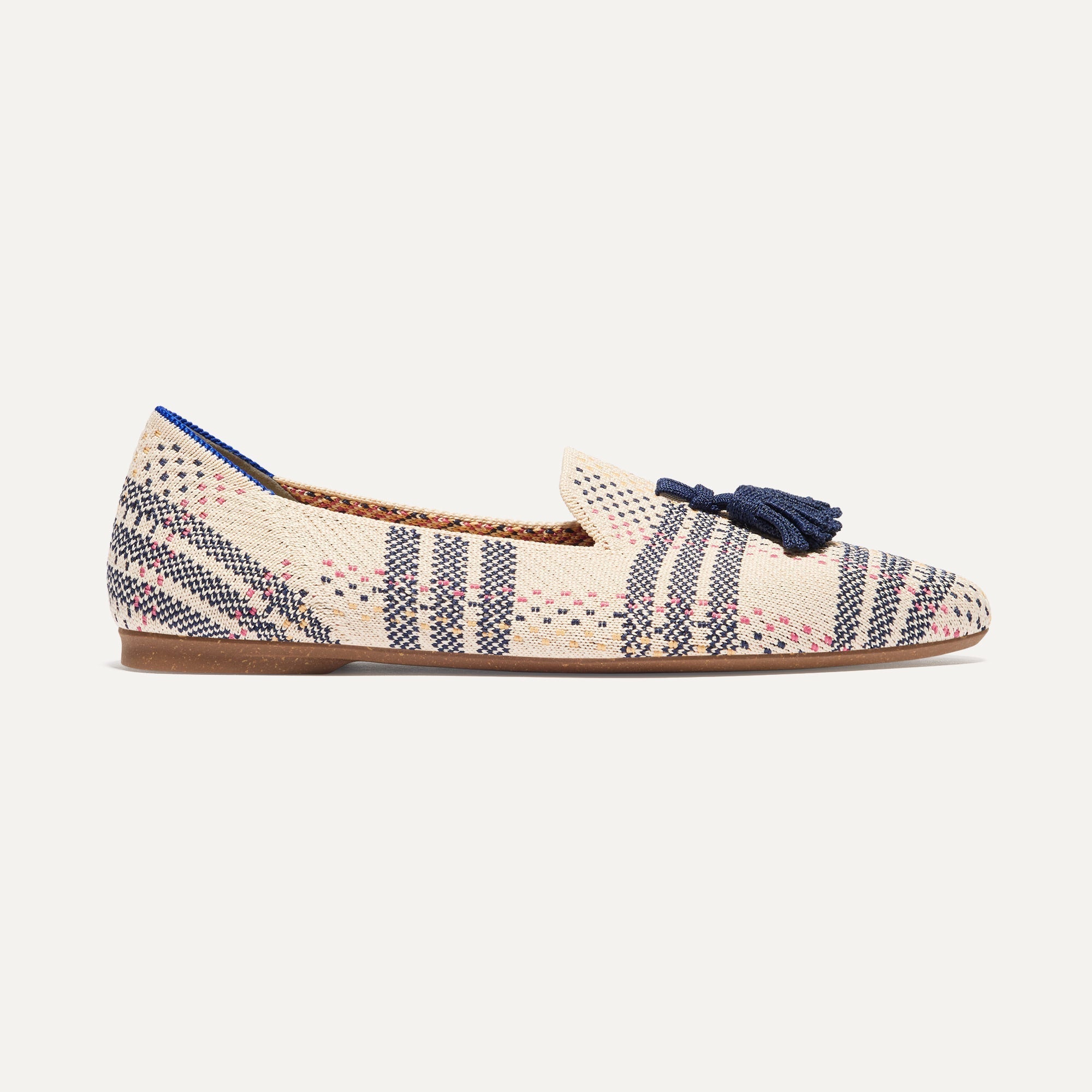 The Almond Tassel Loafer in Spring Plaid shown from the side.