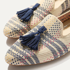 Close up of the tassel and vamp of The Almond Tassel Loafer in Spring Plaid.