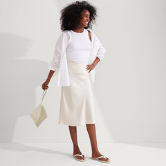 The Wallet Wristlet in Diamond Metallic held by a model, shown from the front.