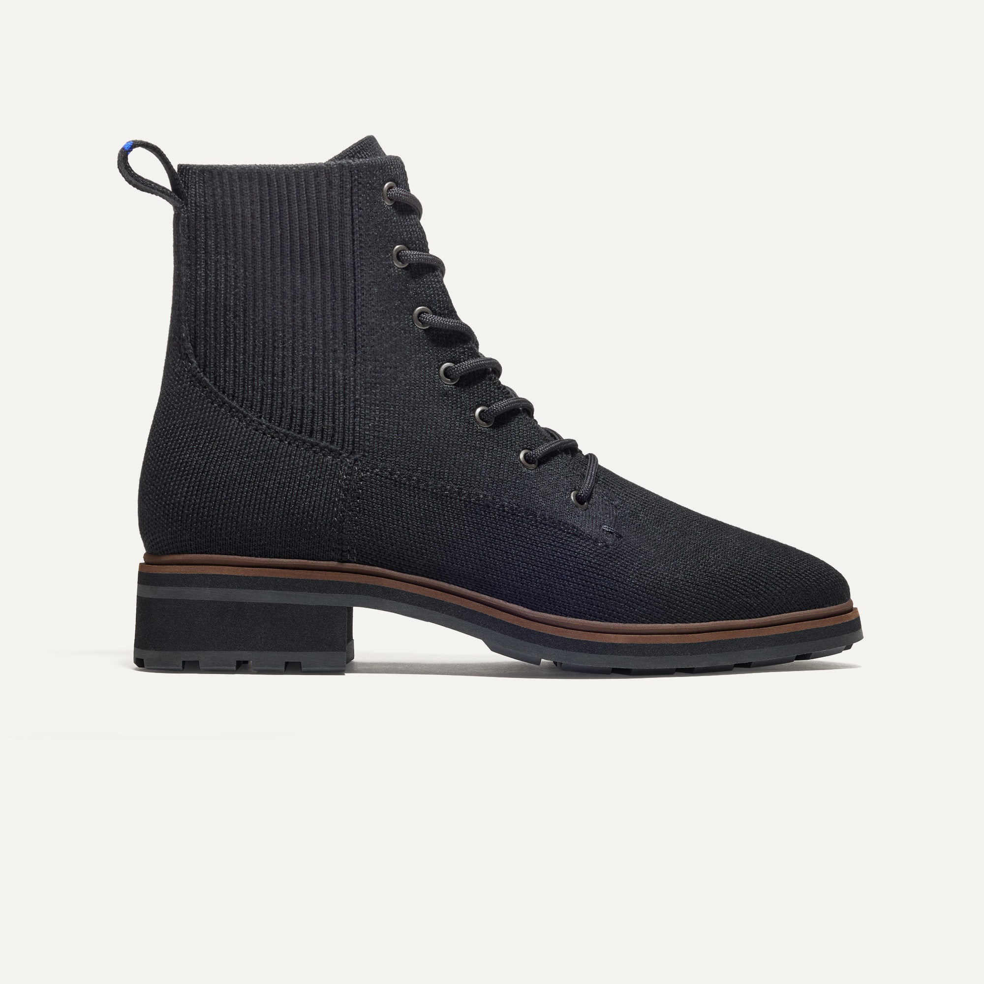 The Laced Lug Boot in Onyx Black shown from the side.