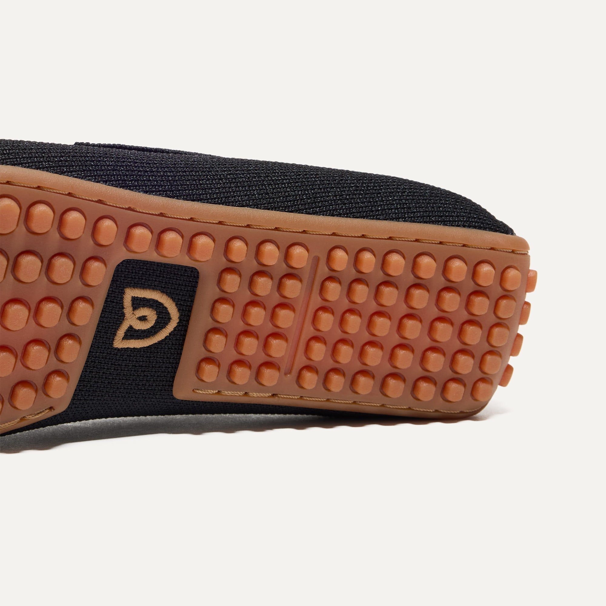 Close up of the raised nub outsoles of The Double Bit Driver in Black.