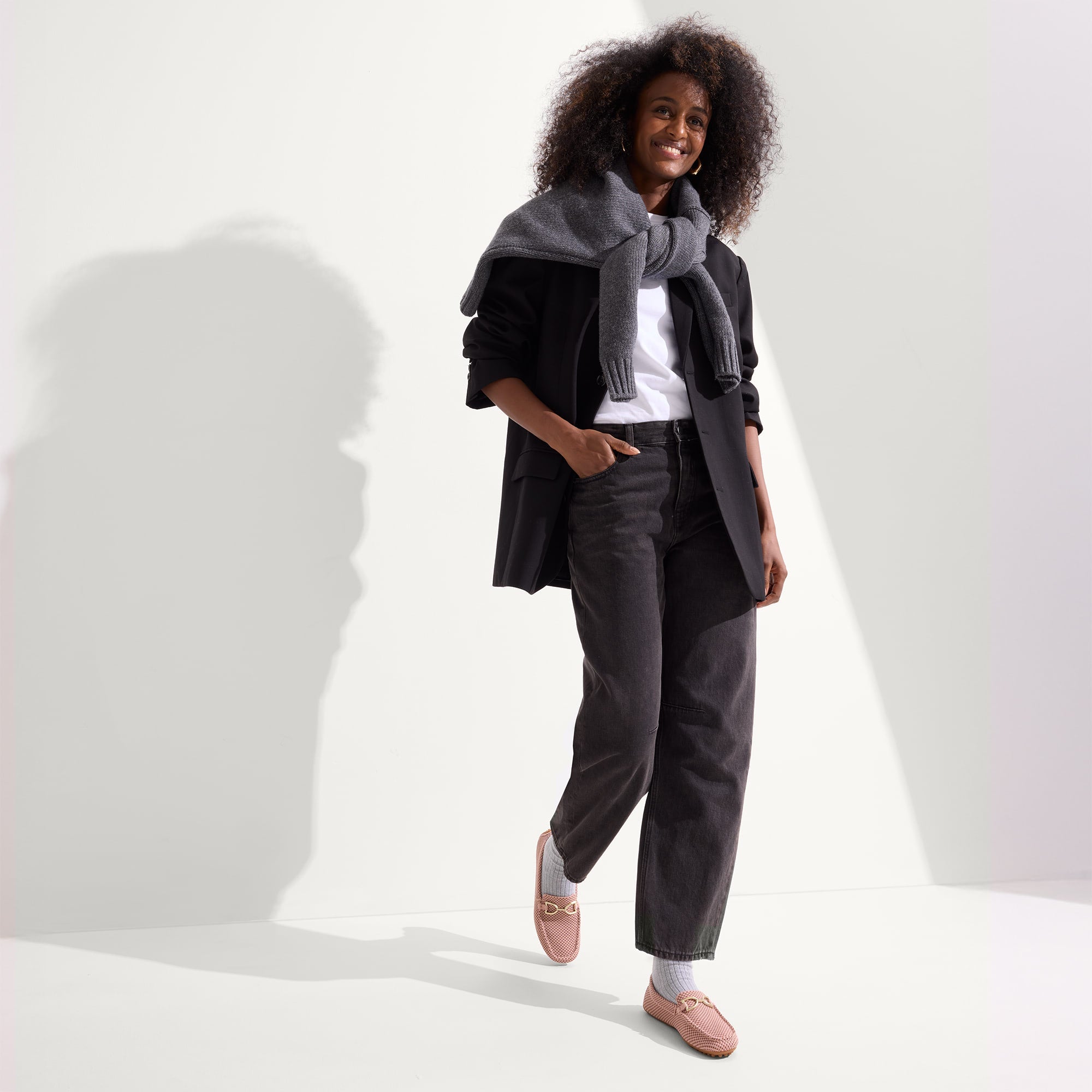 Alternate view of a model wearing The Double Bit Driver in Rose Micro Check.