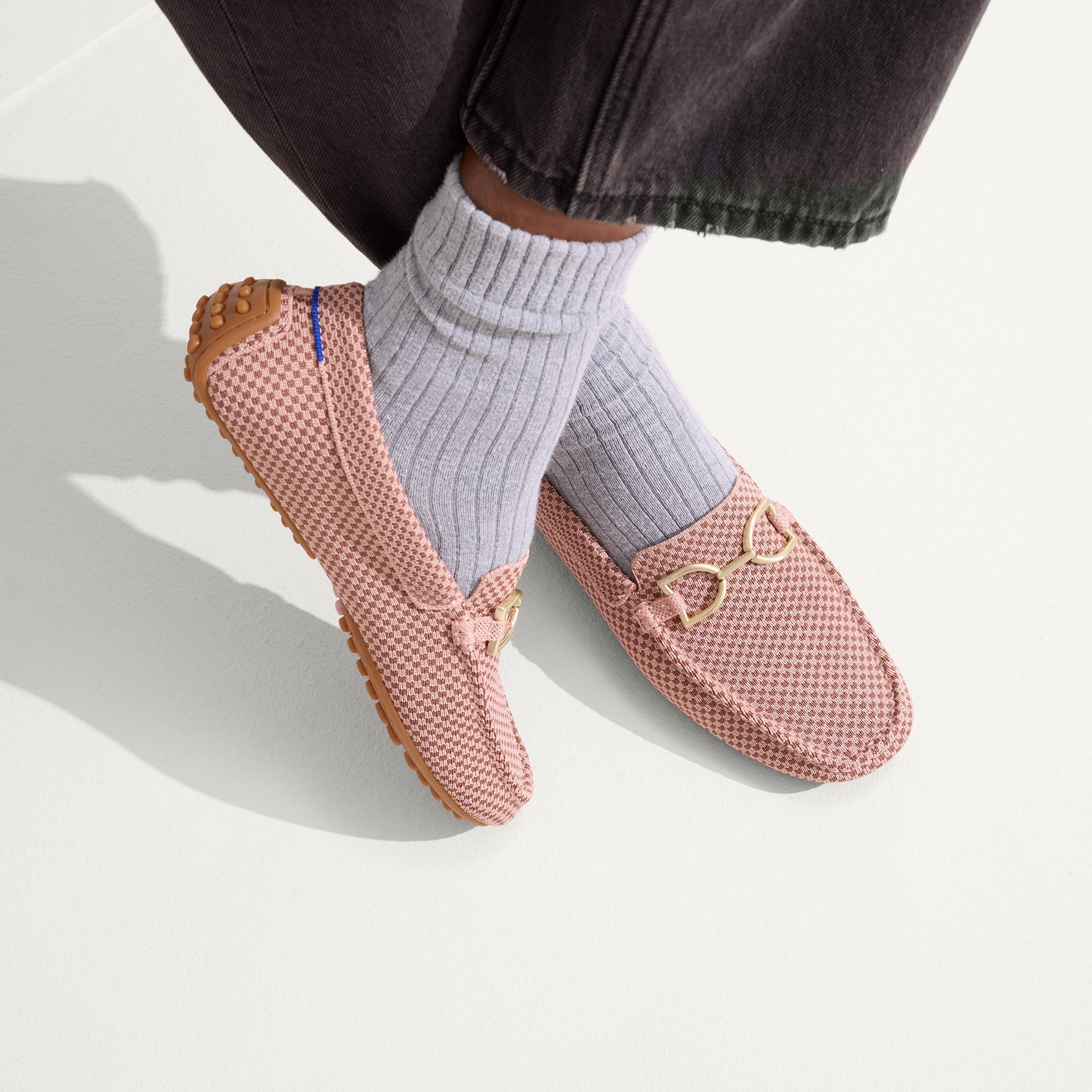 hover | Model wearing The Double Bit Driver in Rose Micro Check.