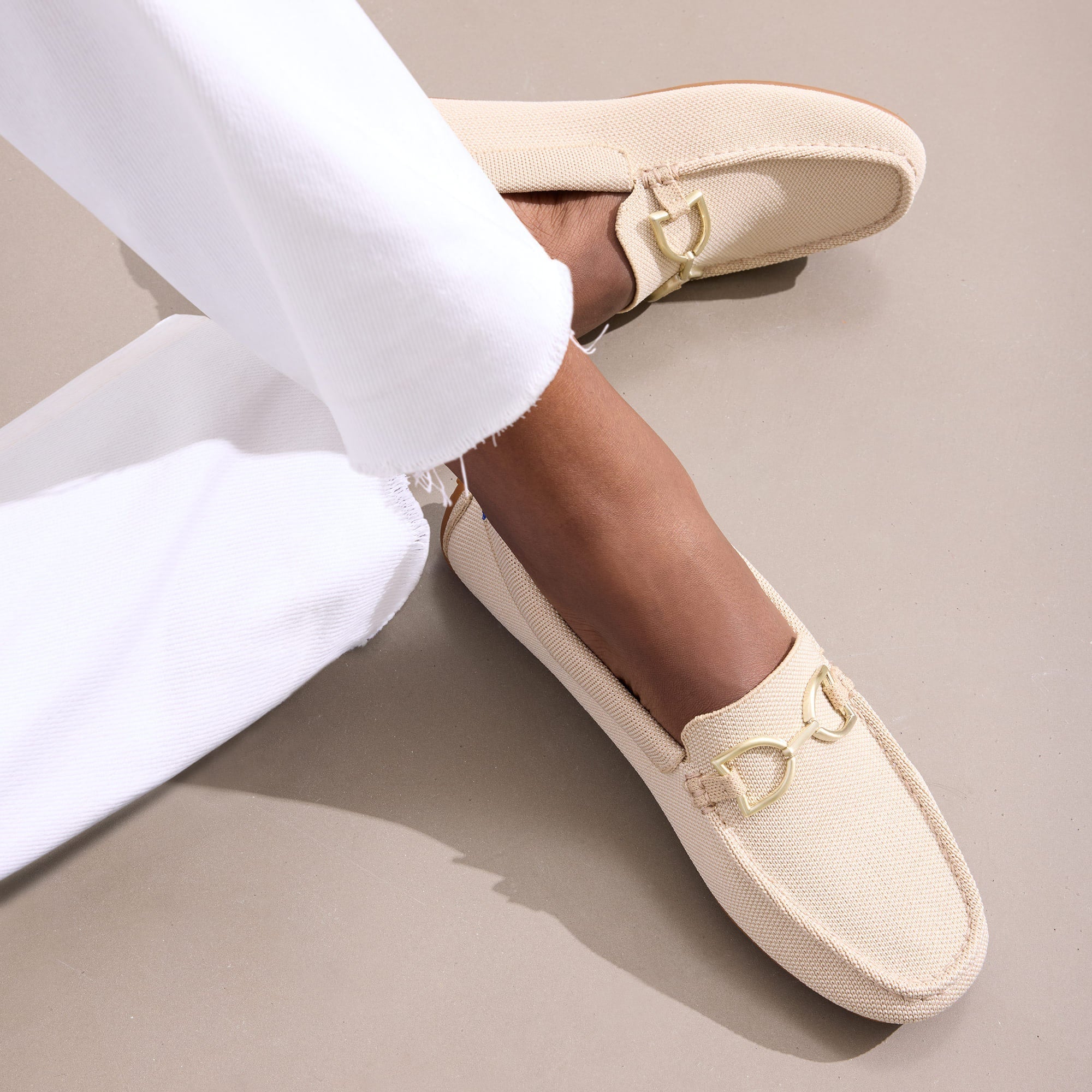 hover | Model wearing The Double Bit Driver in Sesame.