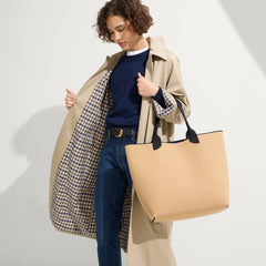 hover | Model holding The Lightweight Tote in Shortbread.