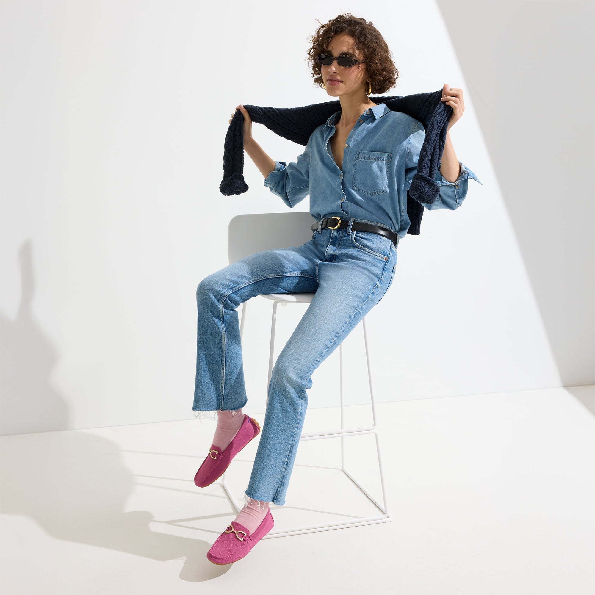 Alternate view of a model wearing The Double Bit Driver in Taffy Pink.