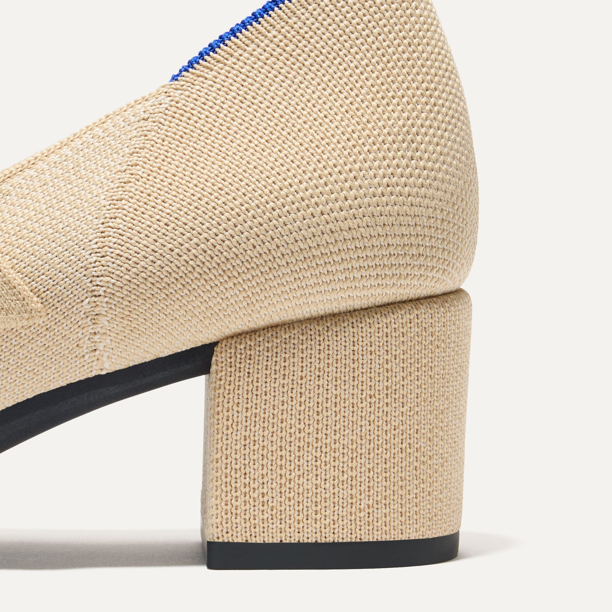 Closeup of the heel on The Mary Jane Heel in Cream Captoe.