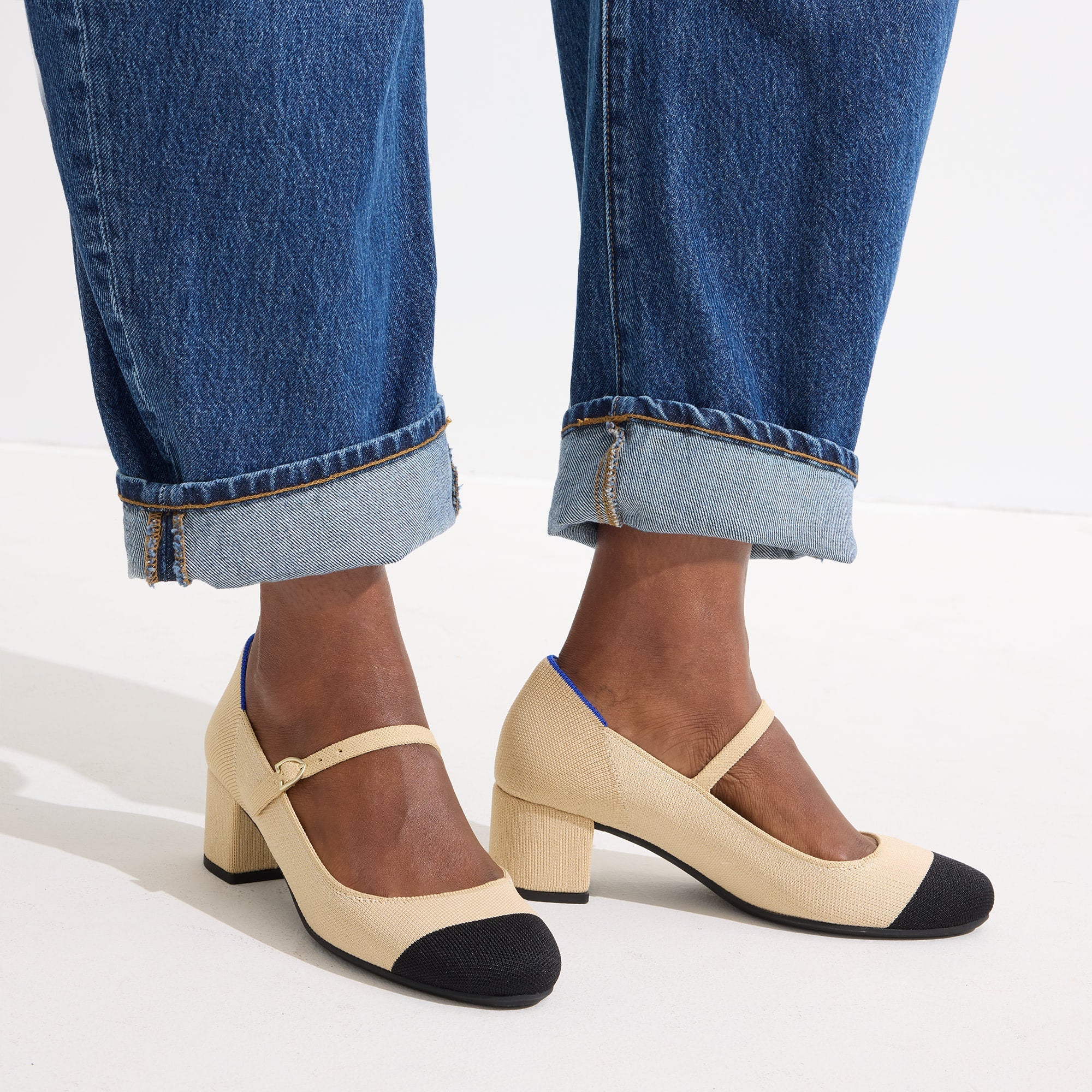 hover | Model wearing The Mary Jane Heel in Cream Captoe.