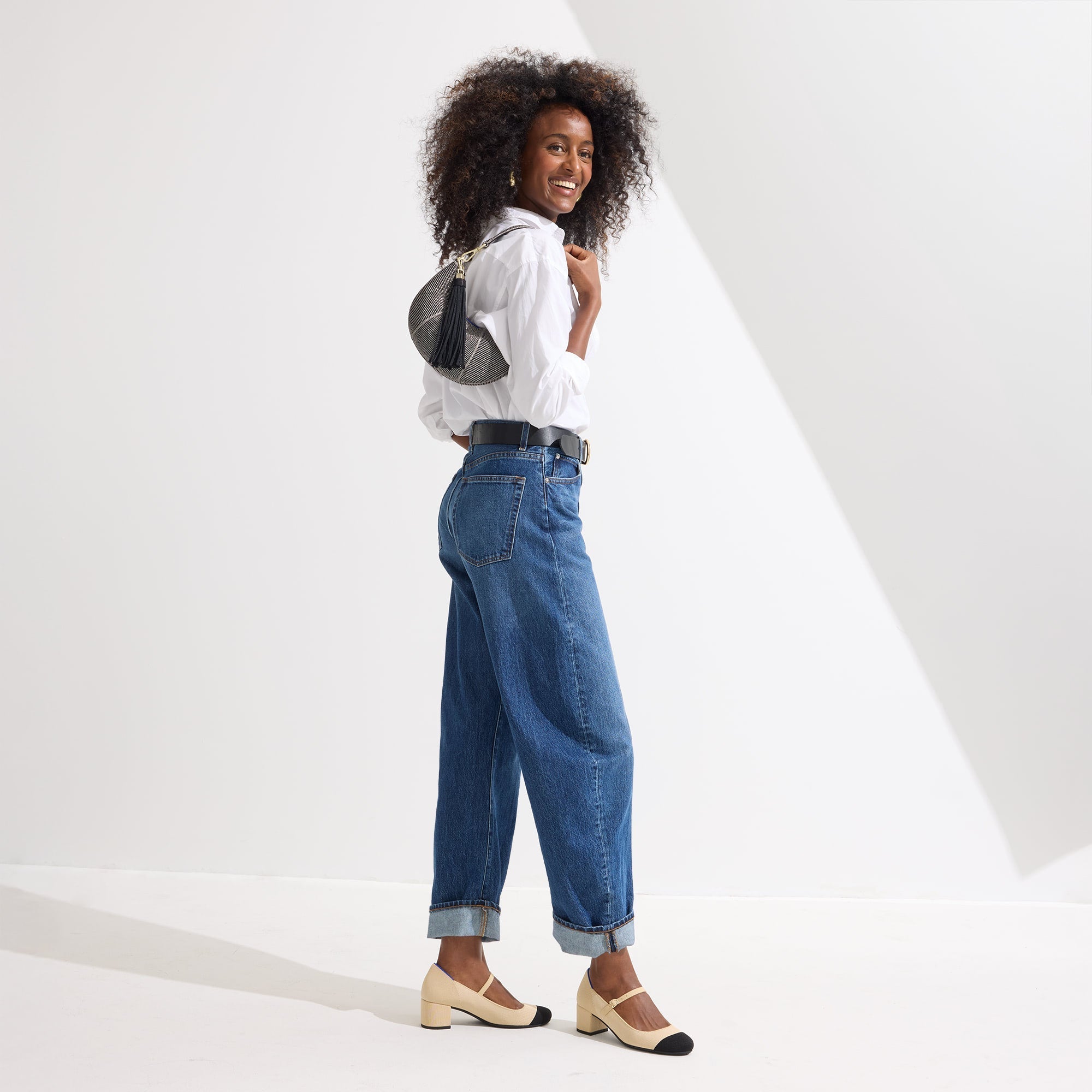 Alternate view of a model wearing The Mary Jane Heel in Cream Captoe.