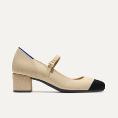 The Mary Jane Heel in Cream Captoe shown from the side.