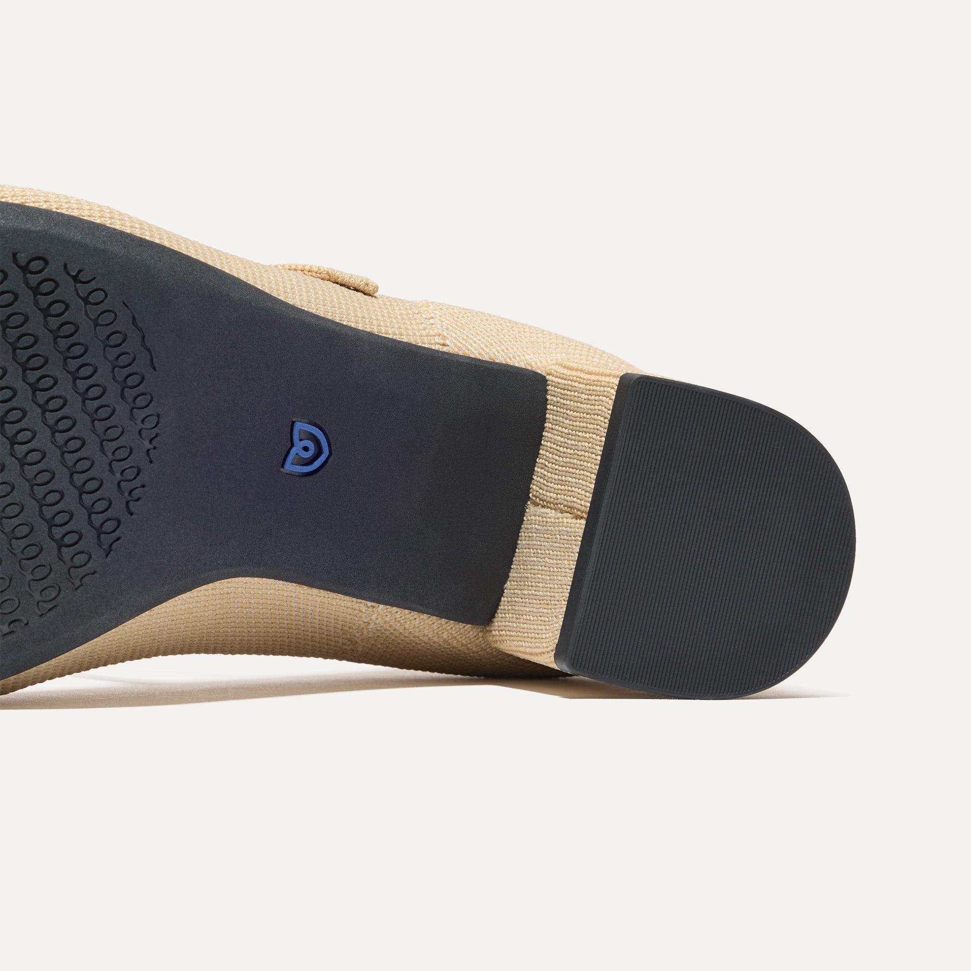 Outsole of The Mary Jane Heel in Cream Captoe.
