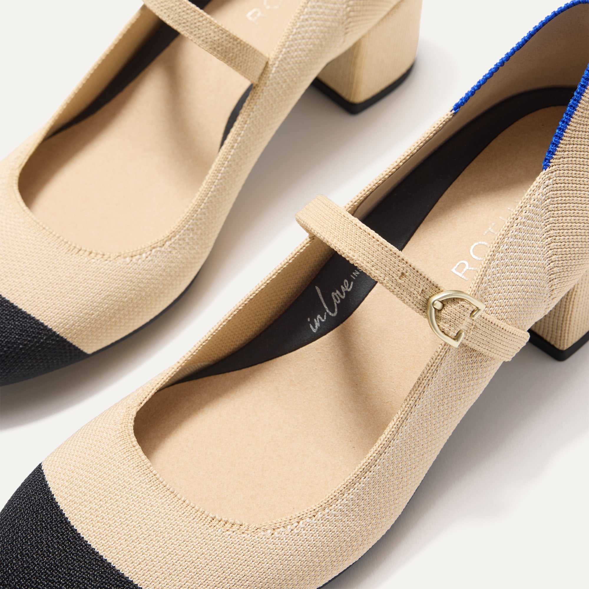 The toe and vamp of The Mary Jane Heel in Cream Captoe, in diagonal view.