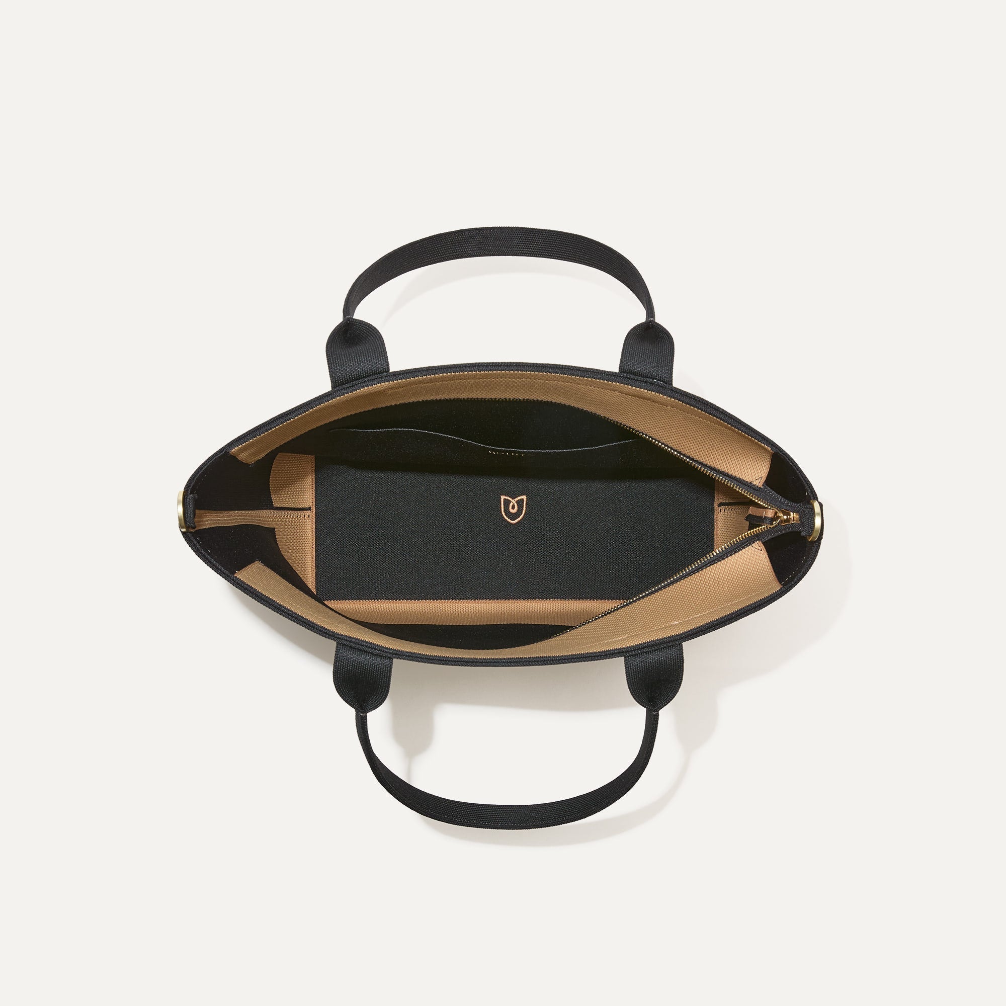 The Lightweight Zip Tote, shown from above with the interior exposed.
