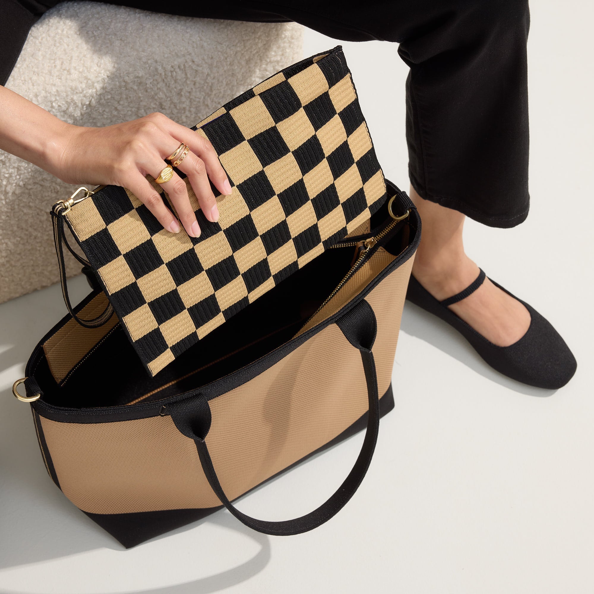 hover | Model holding The Lightweight Zip Tote in Shortbread.