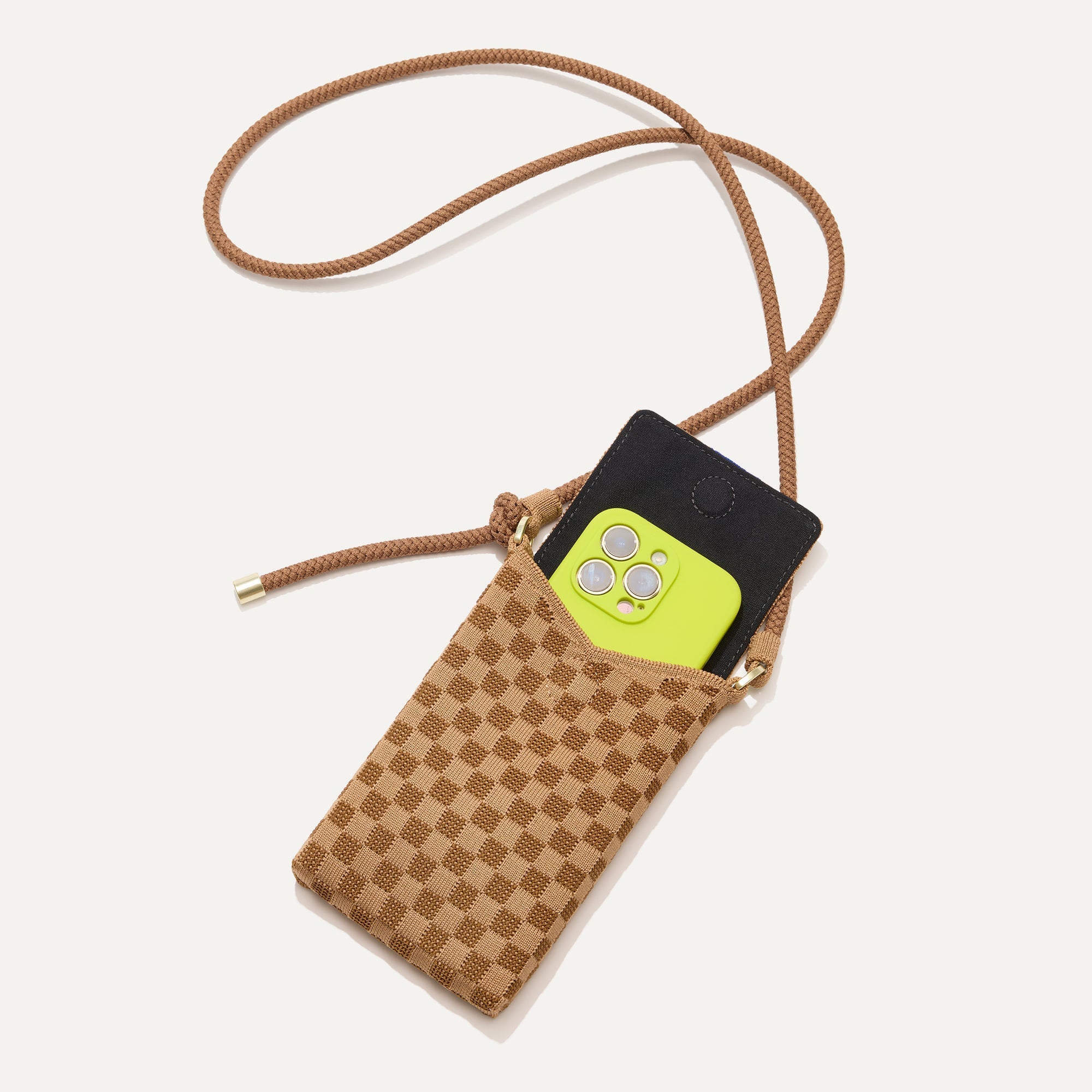 The Phone Crossbody in Hazelnut shown from above with an iPhone inside.
