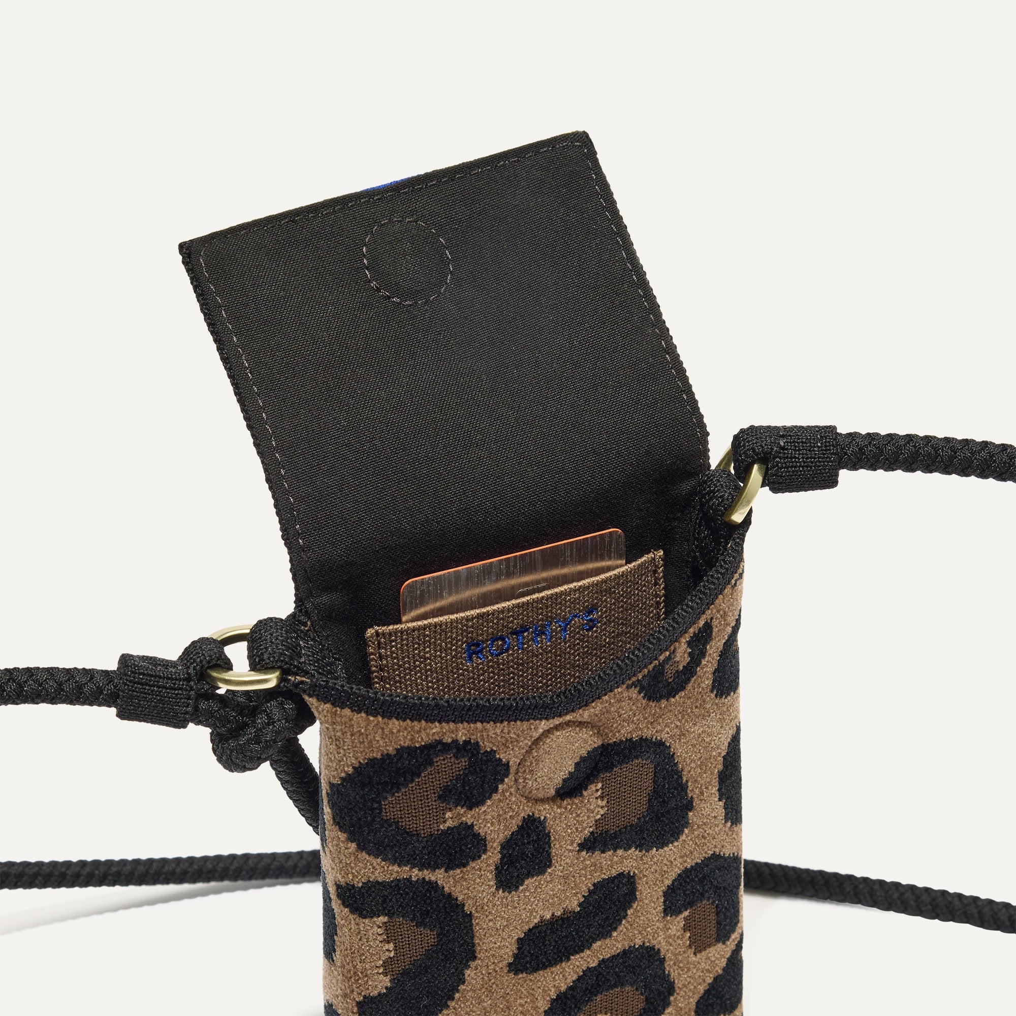 The ReVelvet™ Phone Crossbody in ReVelvet™ Cat shown from above with an iPhone inside.