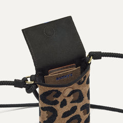The ReVelvet™ Phone Crossbody in ReVelvet™ Cat shown from above with an iPhone inside.