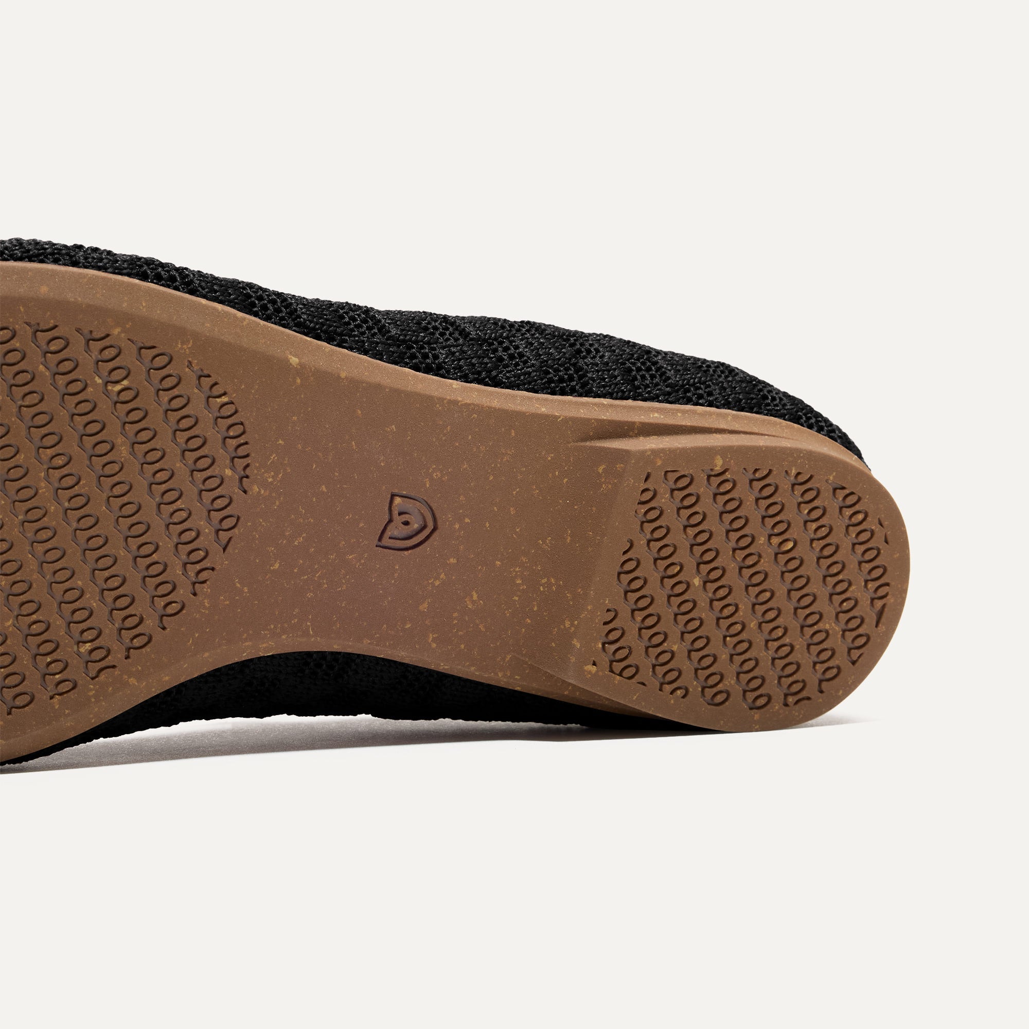 The sole of The Max Square Mary Jane in Black Sand shown in diagonal view.