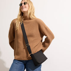 The Casual Crossbody in Night Song, worn as a crossbody by a model, shown from the side. 