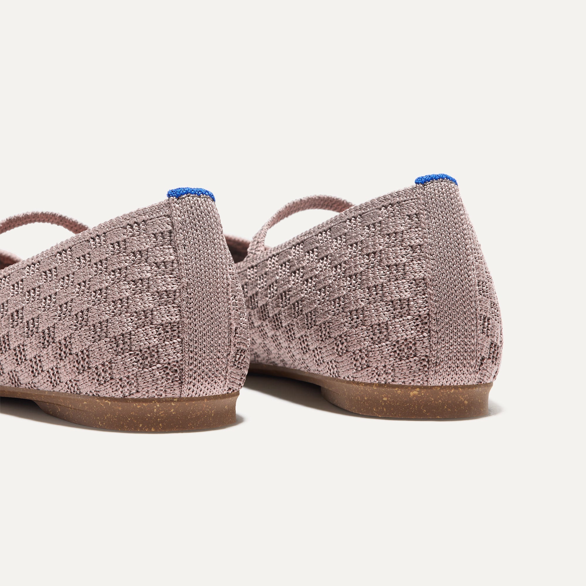 Close up of the heel of The Max Square Mary Jane in Dusty Lilac Basketweave, with Rothy's signature blue halo.