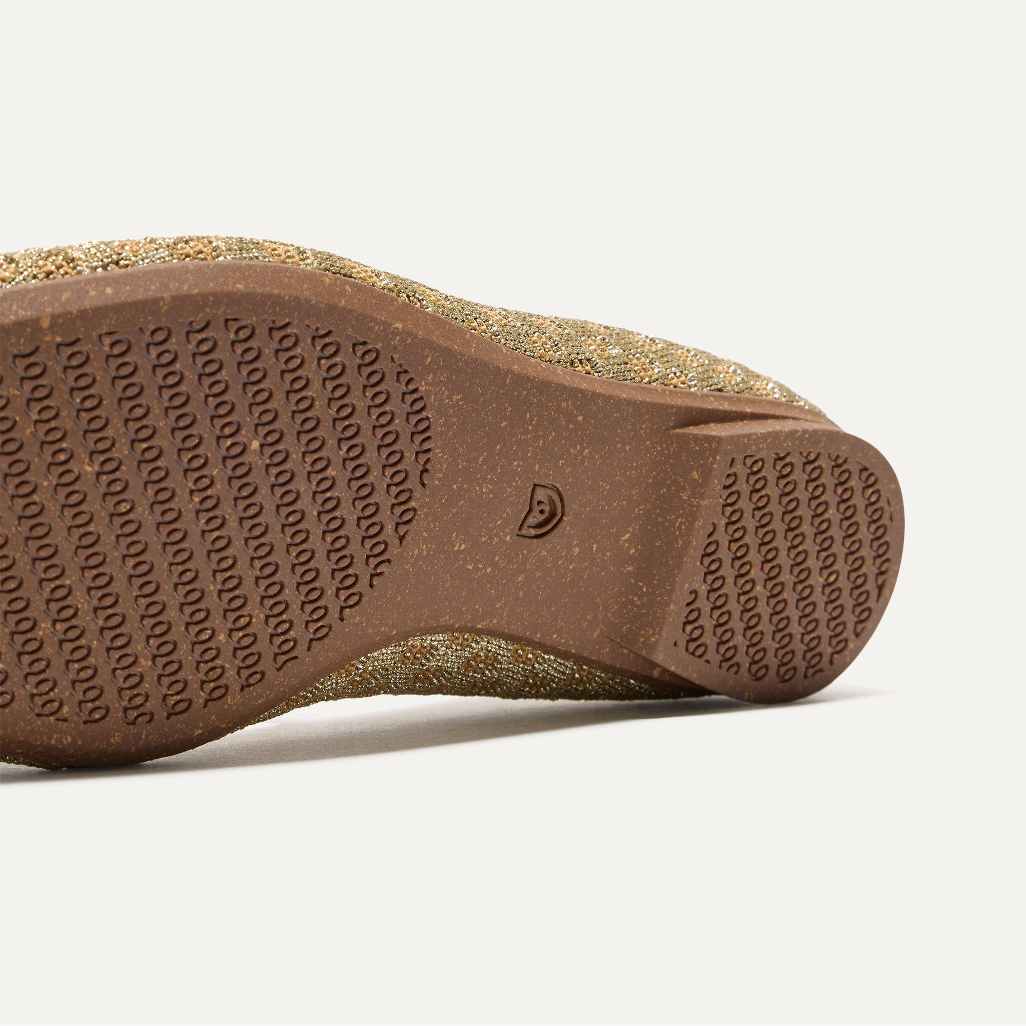 The sole of The Max Square Mary Jane in Golden Crisp Basketweave shown in diagonal view.