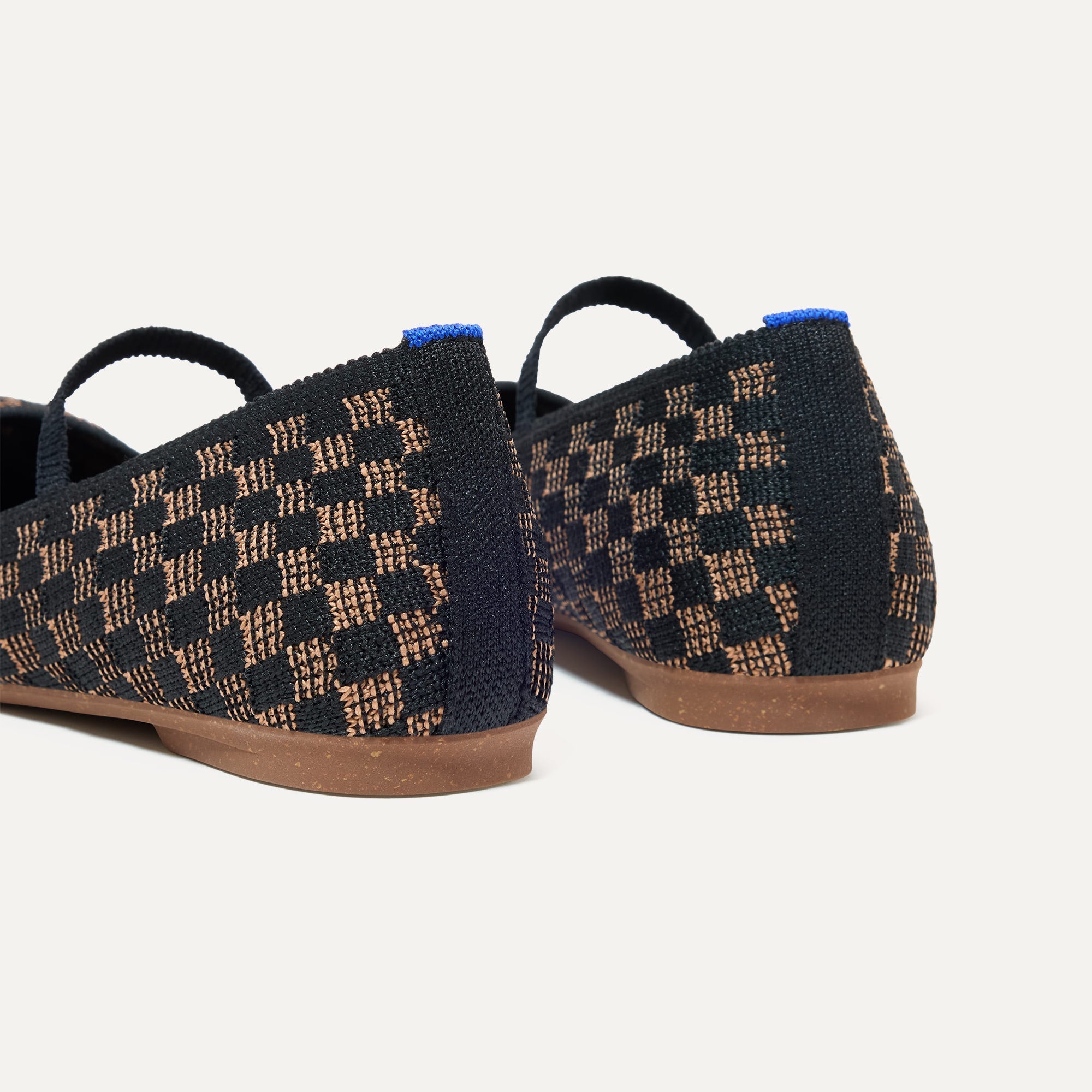 Close up of the heel of The Max Square Mary Jane in Night Song, with Rothy's signature blue halo.