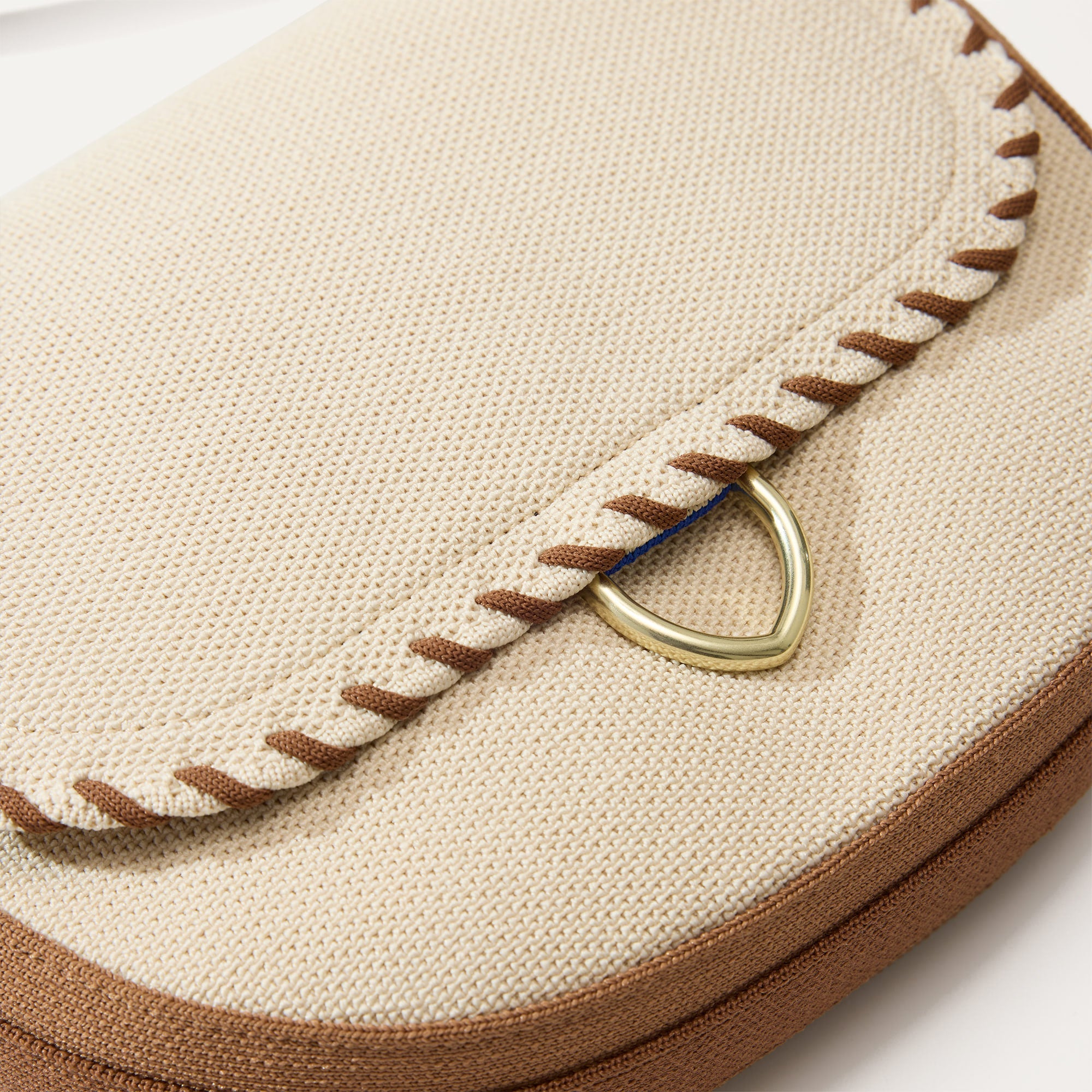 Close up of The Saddle Bag in Flat White shown laid down.