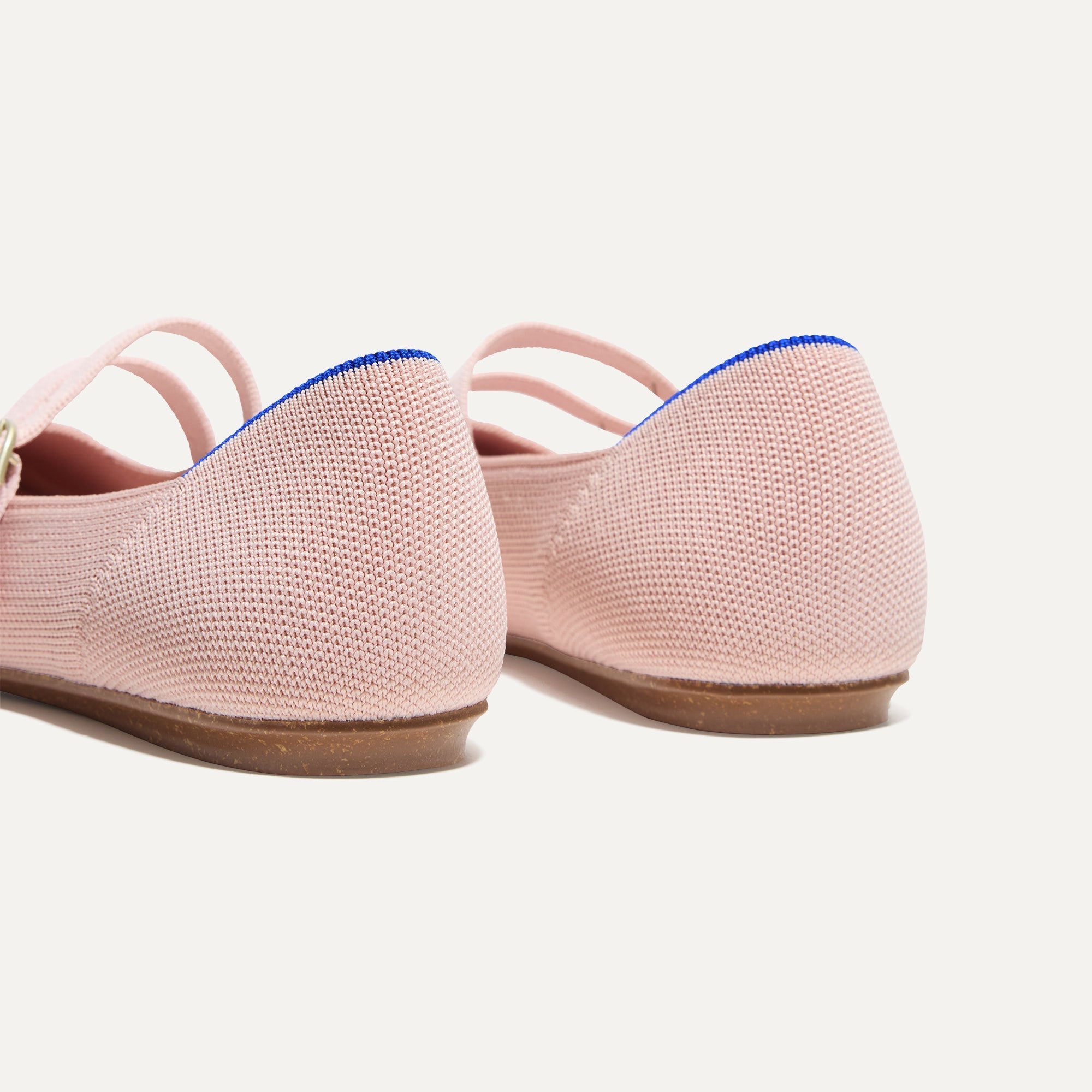 Close up of the heel of The Double Buckle Mary Jane in Ballerina, with Rothy's signature blue halo.