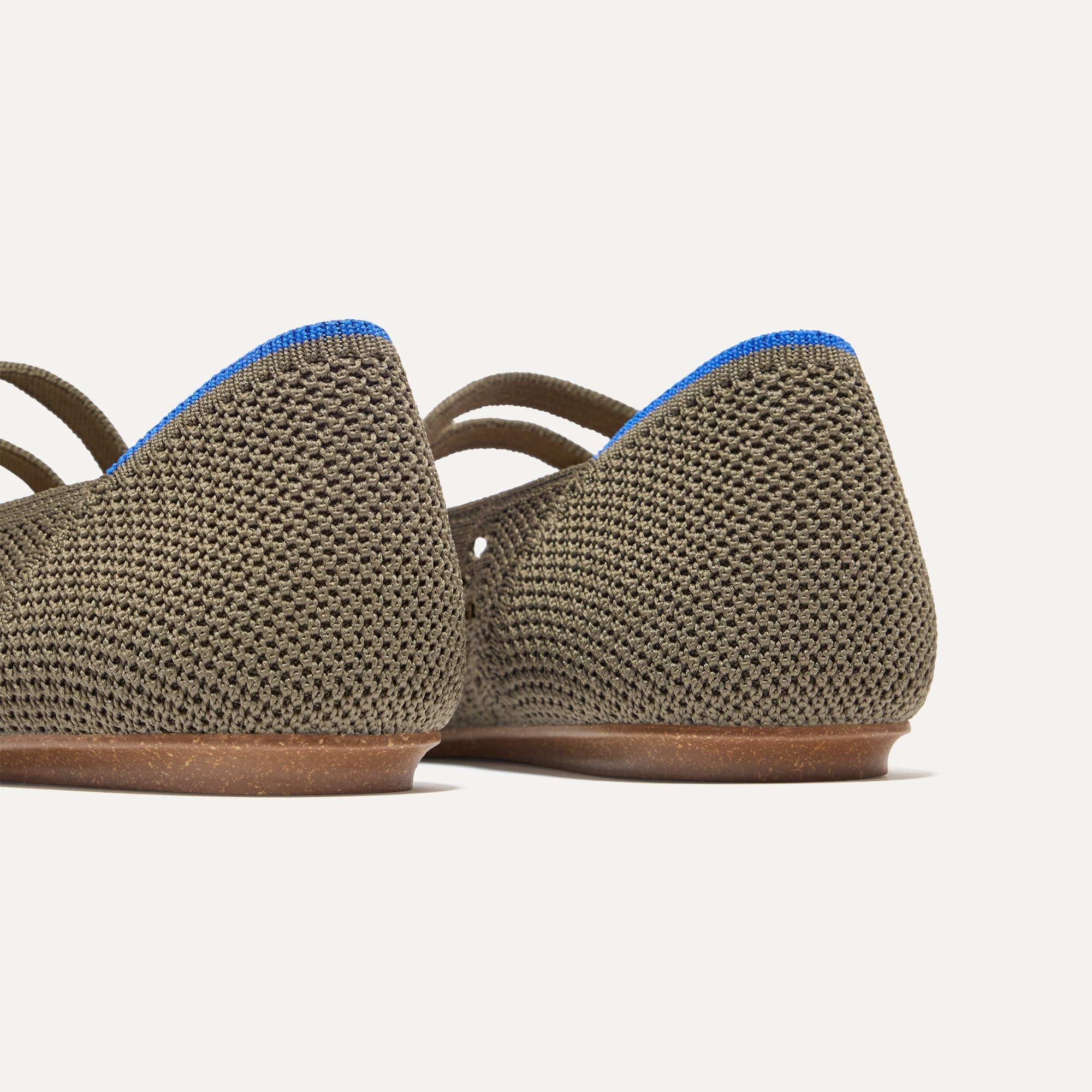 Close up of the heel of The Double Buckle Mary Jane in Safari Crochet, with Rothy's signature blue halo.