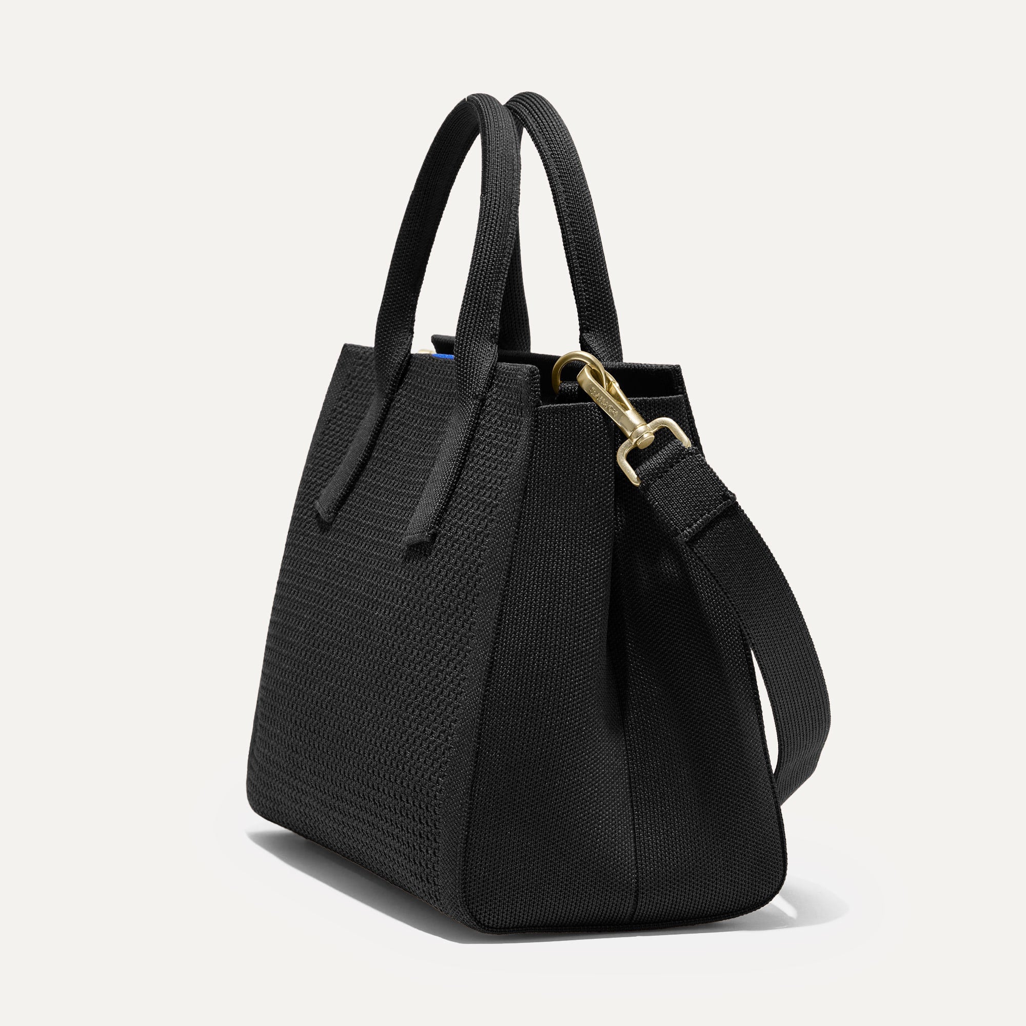The Classic Handbag in Black shown in diagonal view.