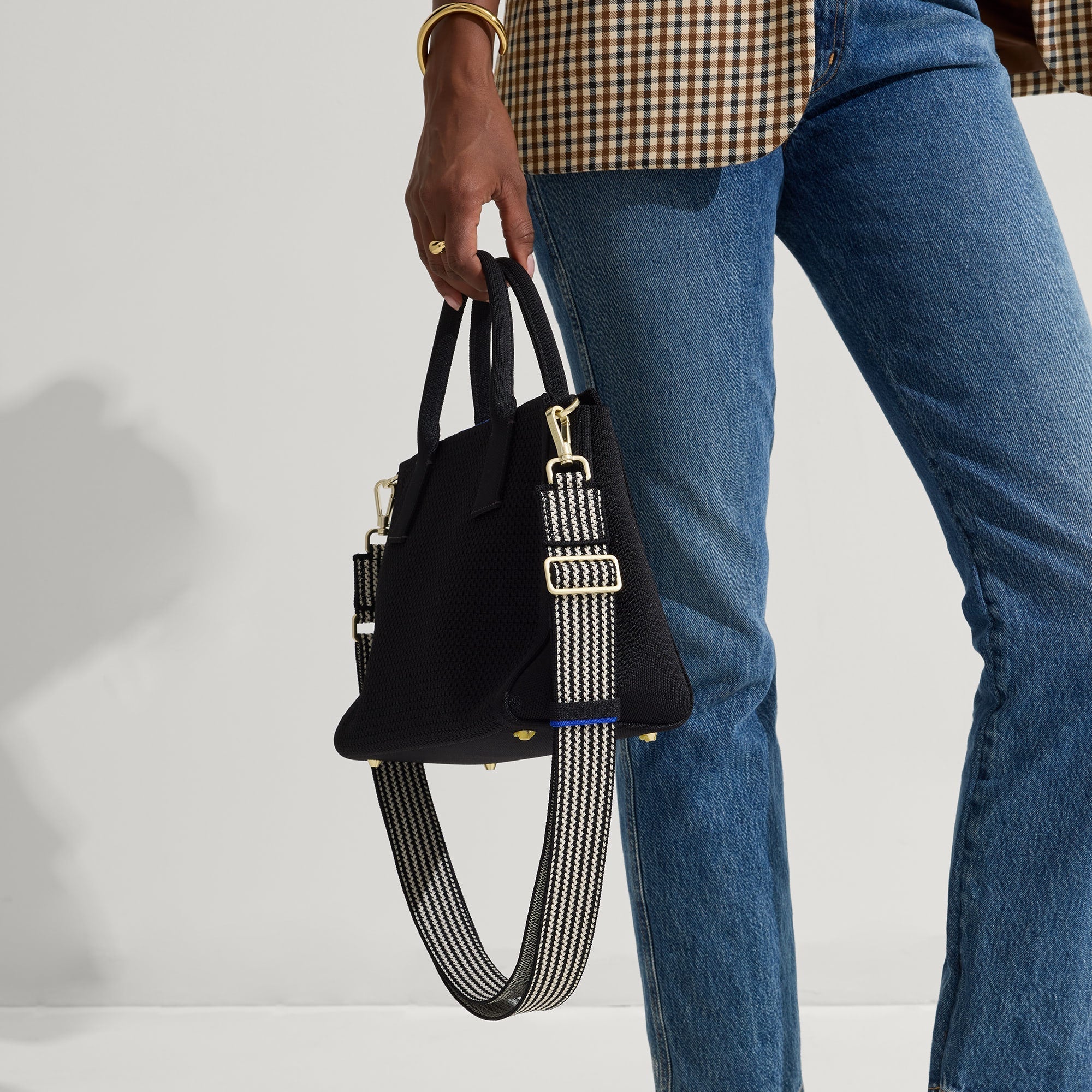 hover | Model wearing The Crossbody Strap in Salt and Pepper paired with The Classic Handbag.