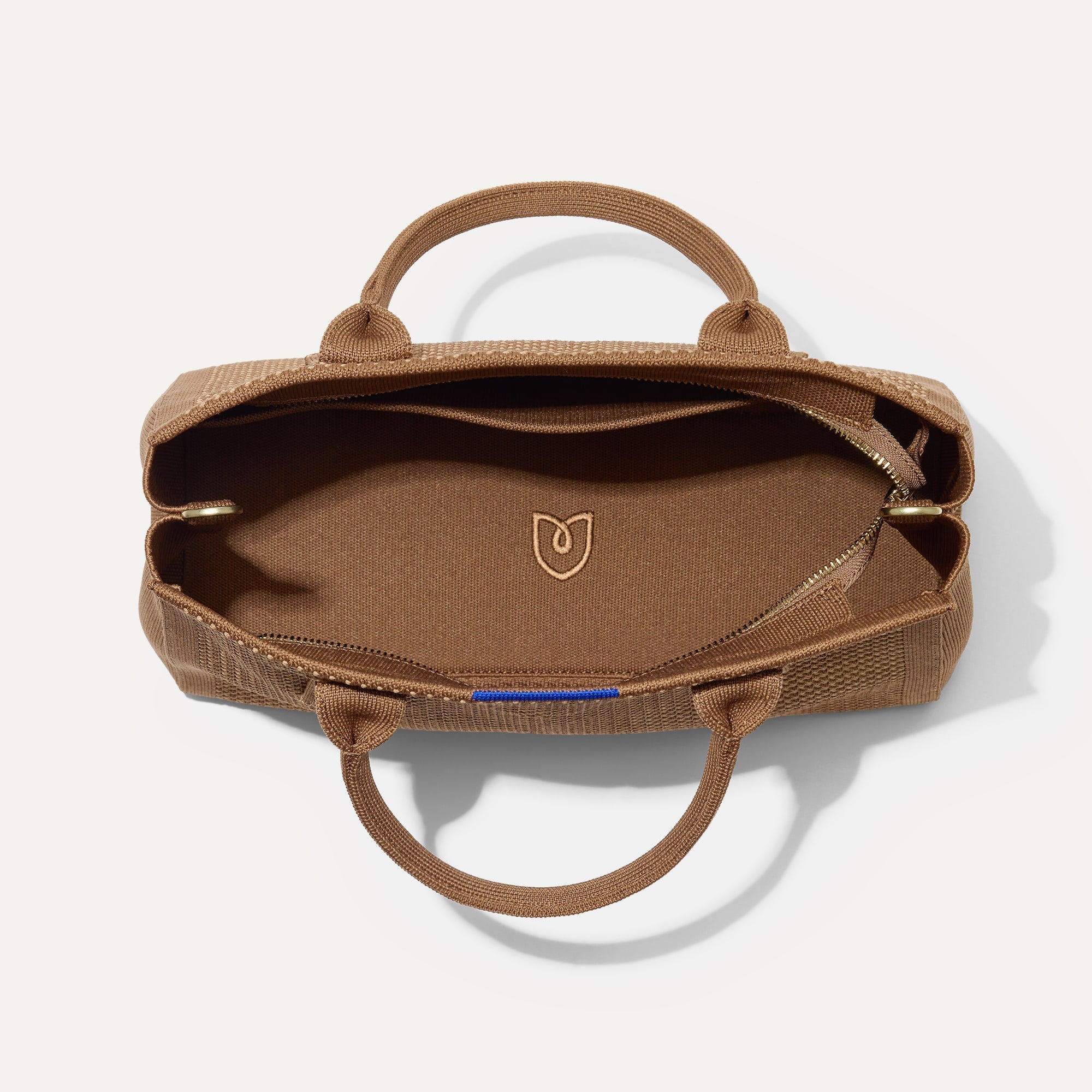 The Classic Handbag in Sierra Brown shown open from the top.