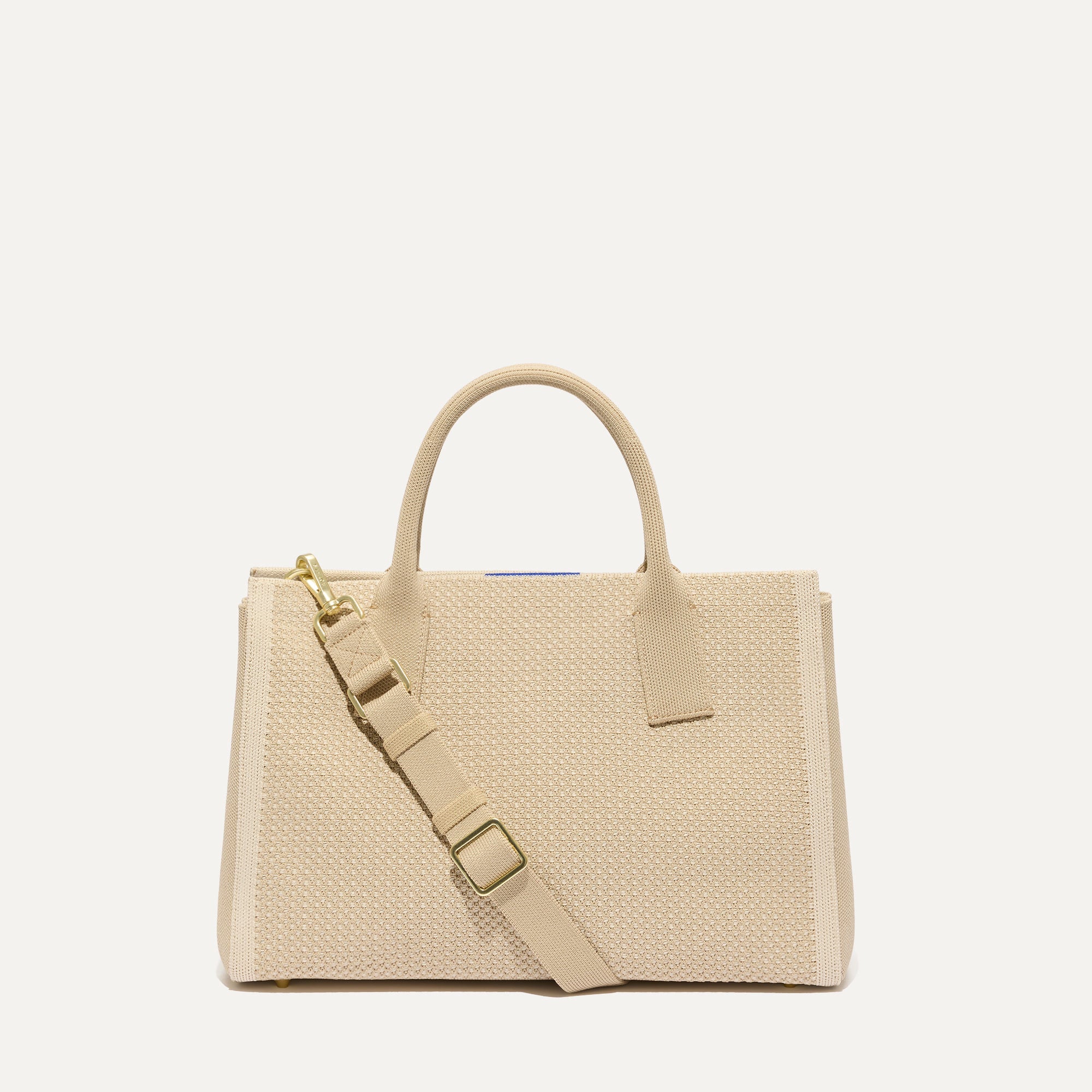 PLP |The Classic Handbag in Soft Sesame shown from the front.