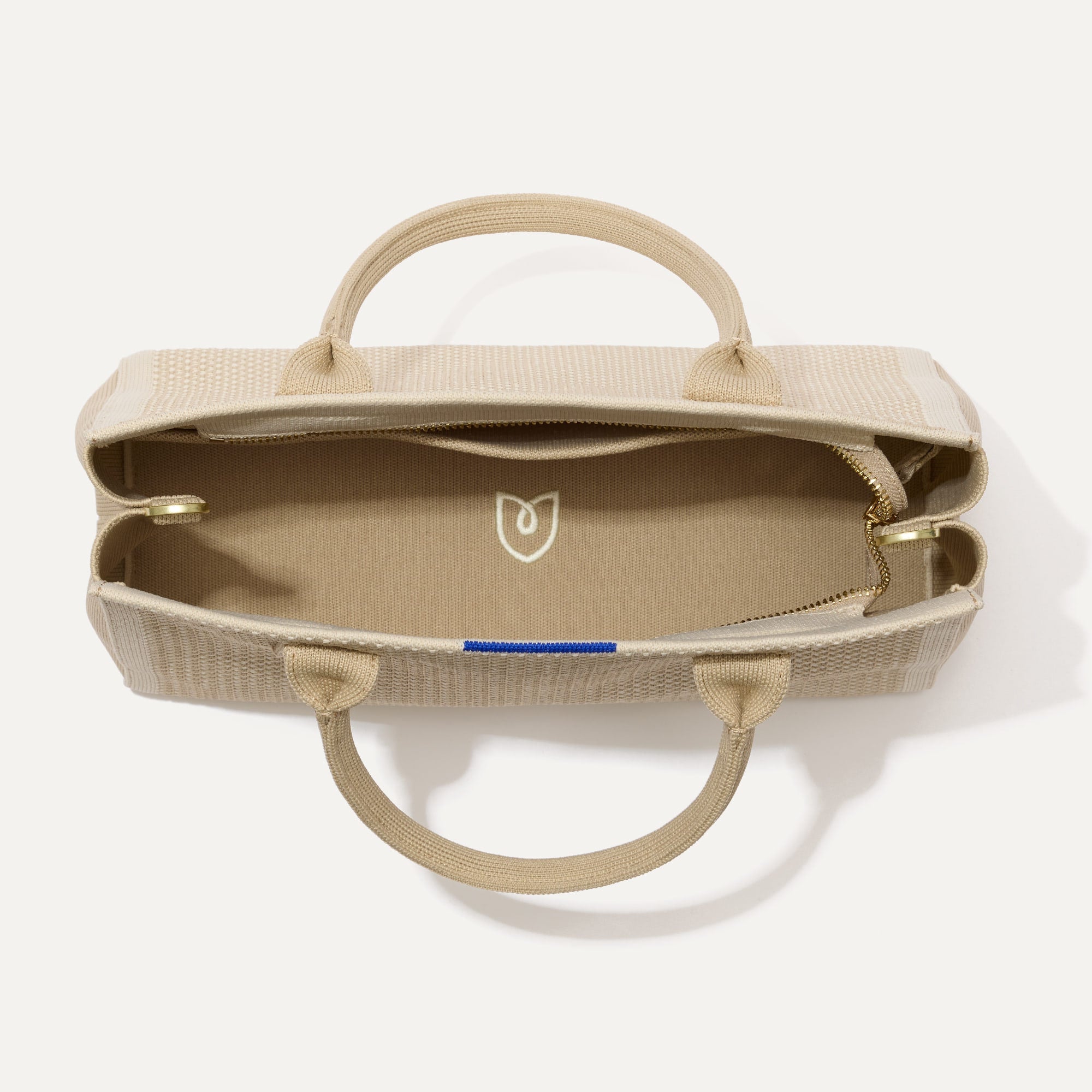 The Classic Handbag in Soft Sesame shown open from the top.