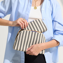 hover | Model shown holding the large and small pouch of The Vanity Set in Cabana Stripe.