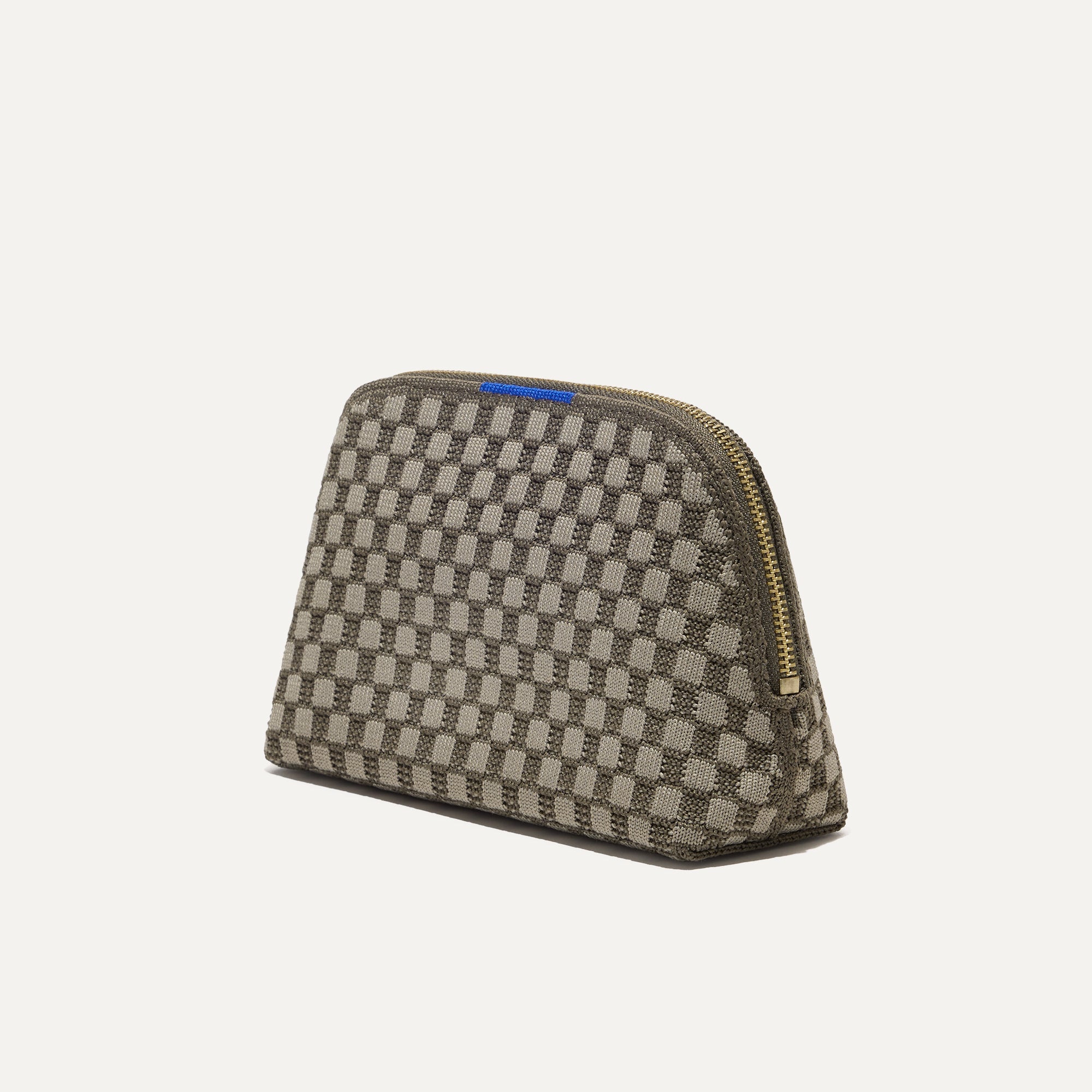 The small pouch of The Vanity Set in Safari Green shown in diagonal view.