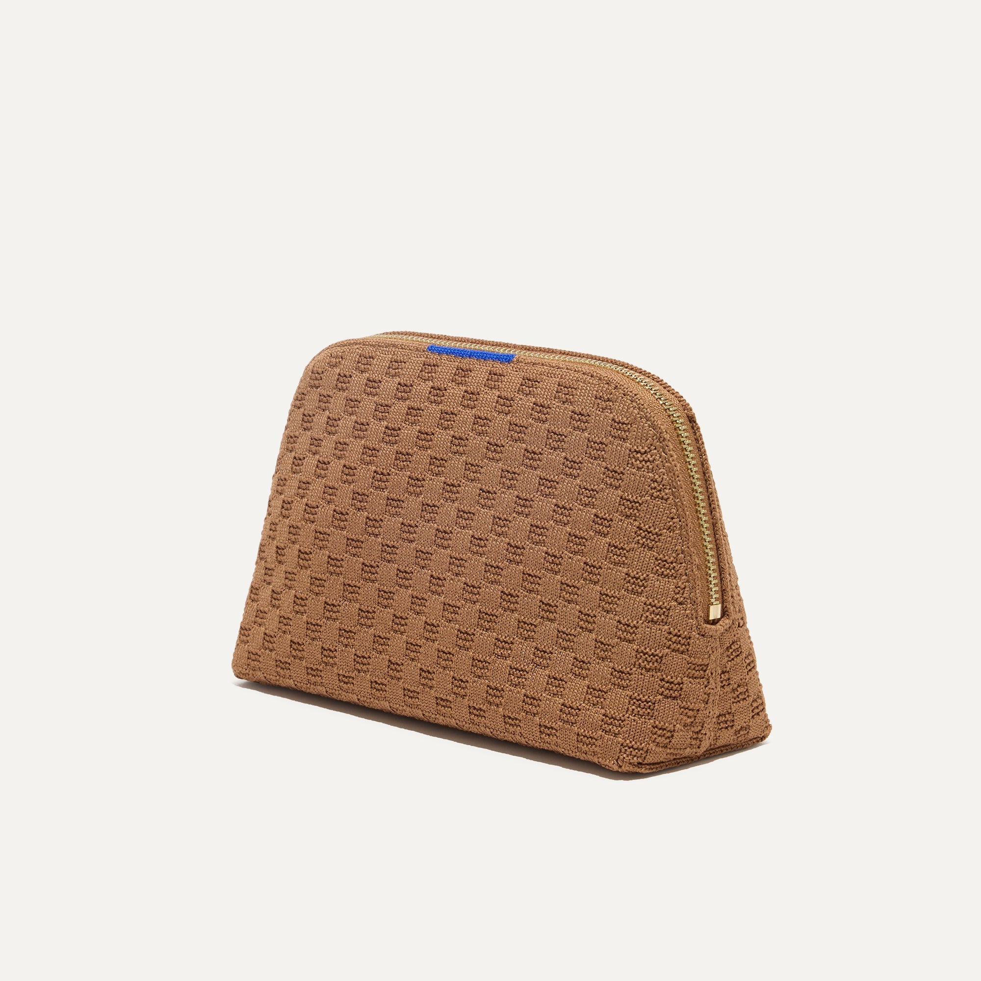 The small pouch of The Vanity Set in Vanilla Wafer shown in diagonal view.