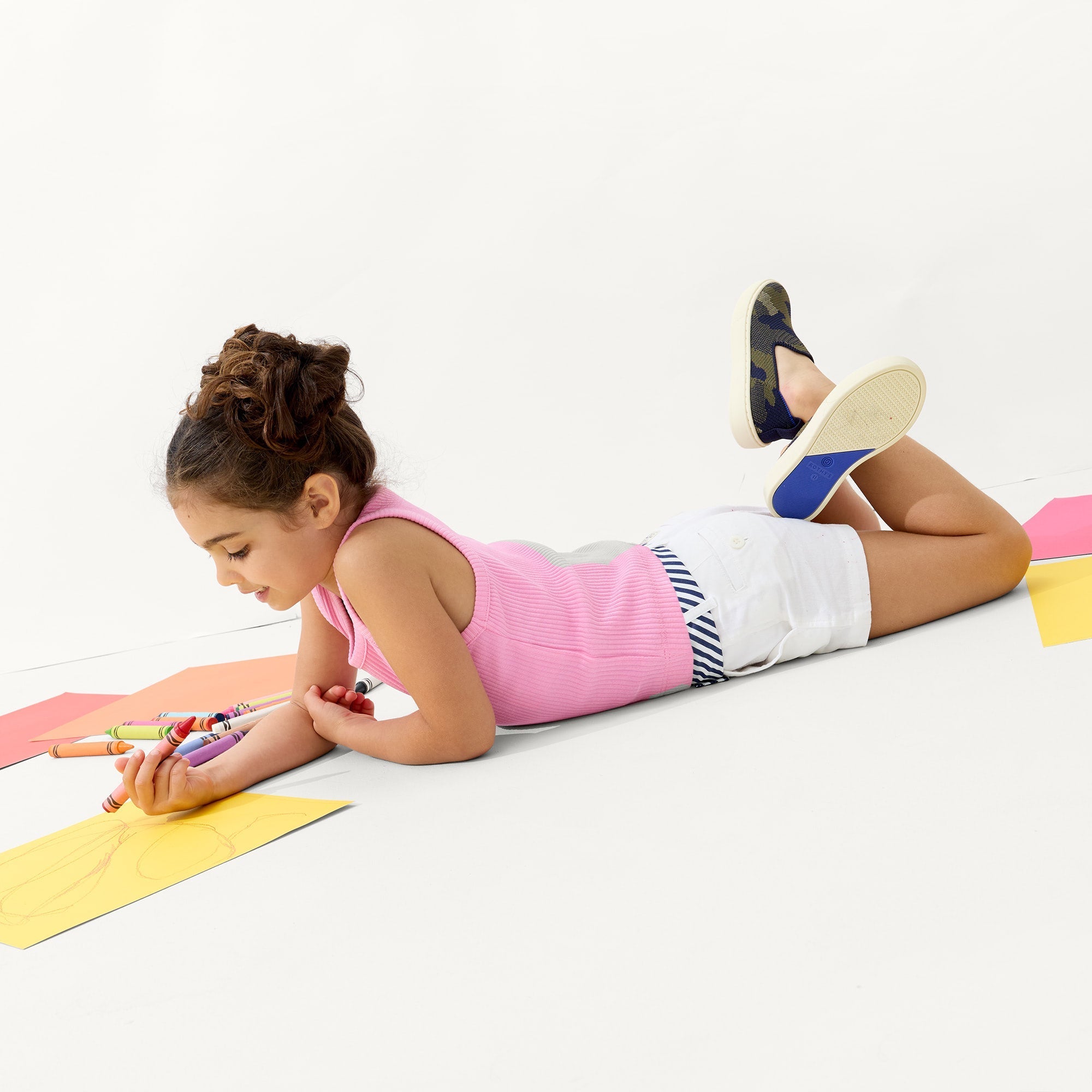 Alternate view of a model wearing The Kids Sneaker in Spruce Camo.